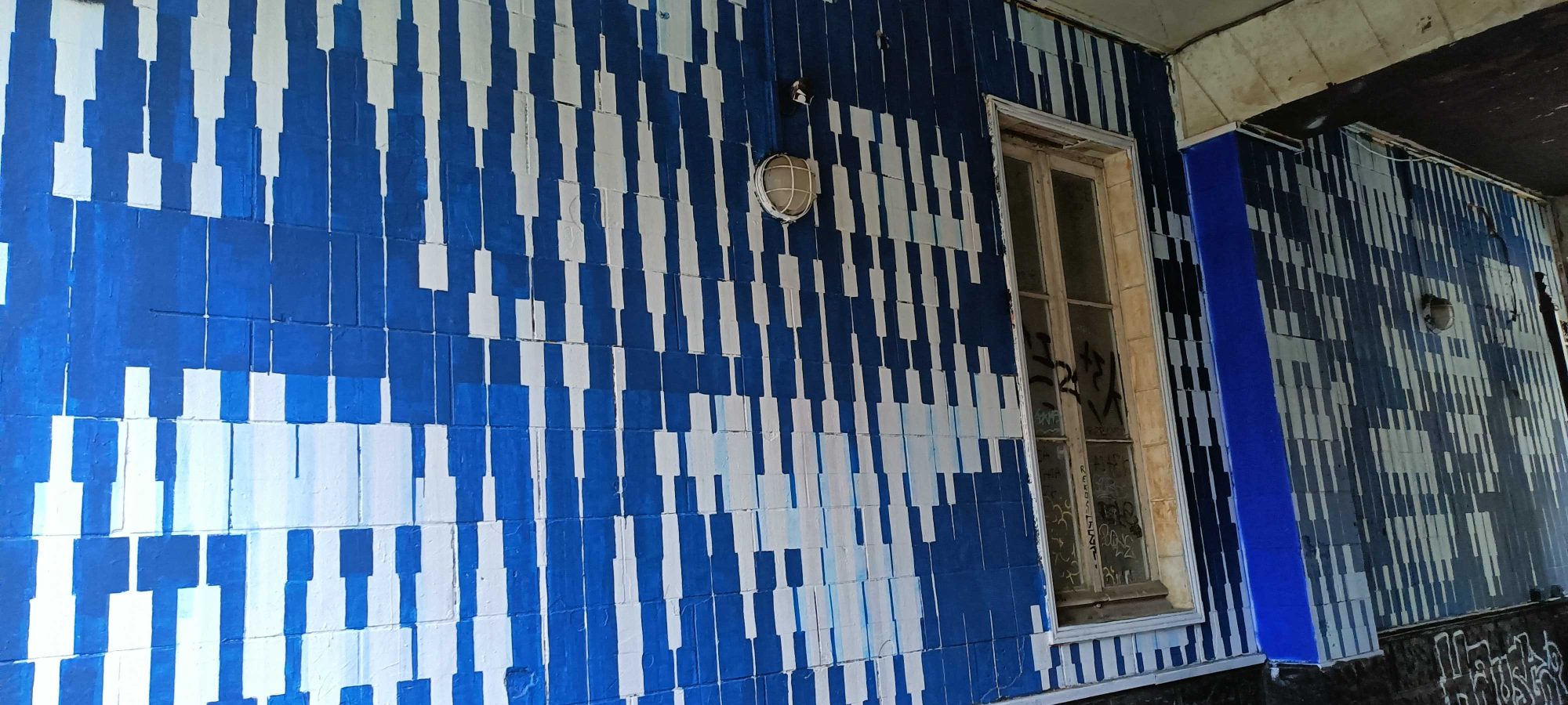 Facade Covered with Blue and White Tiles — Street art in Nantes