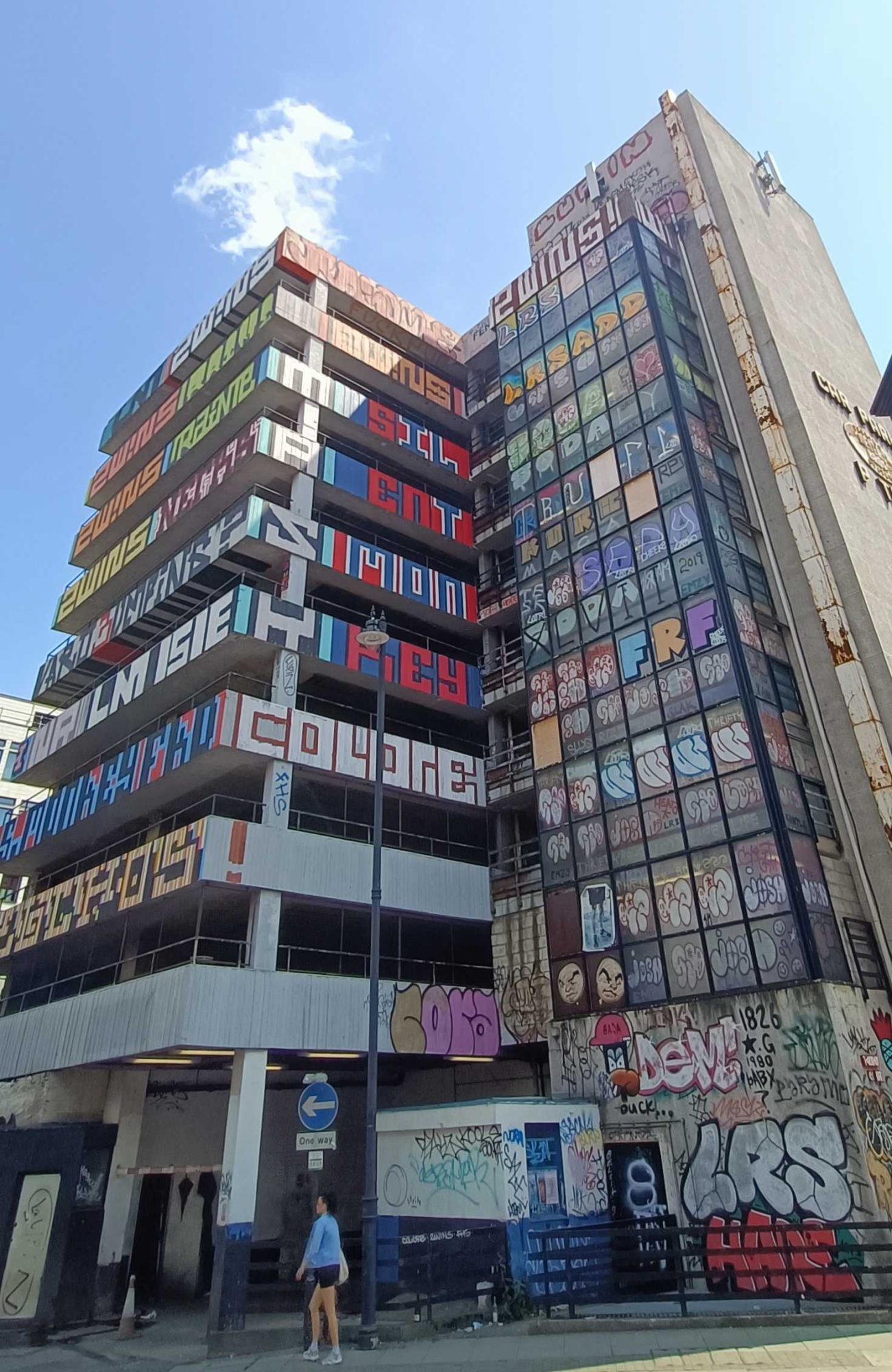 Building with Fragmented Vertical Lettering — Street art in London