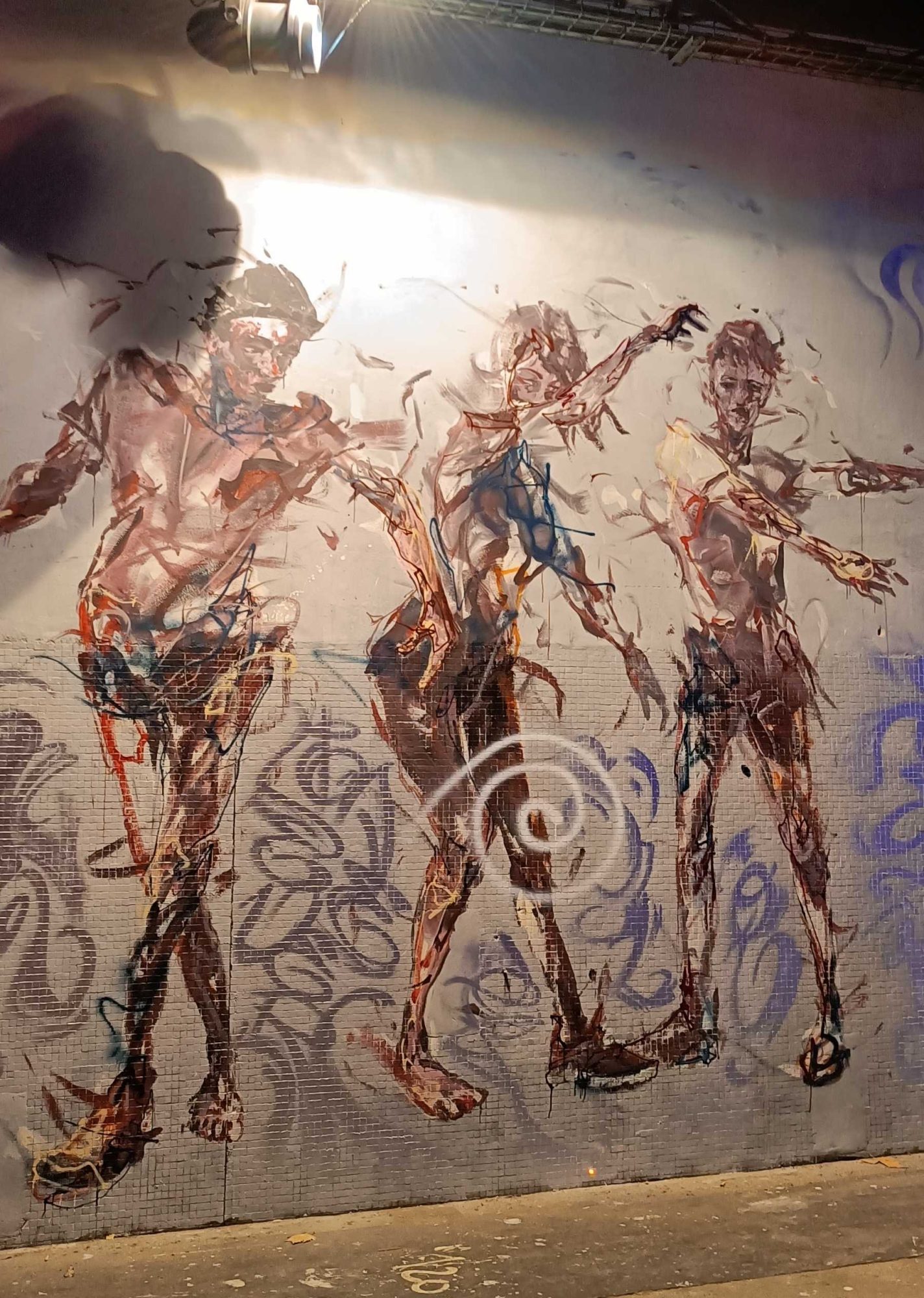 Trio of Figures in Expressive Motion — Street art in Paris
