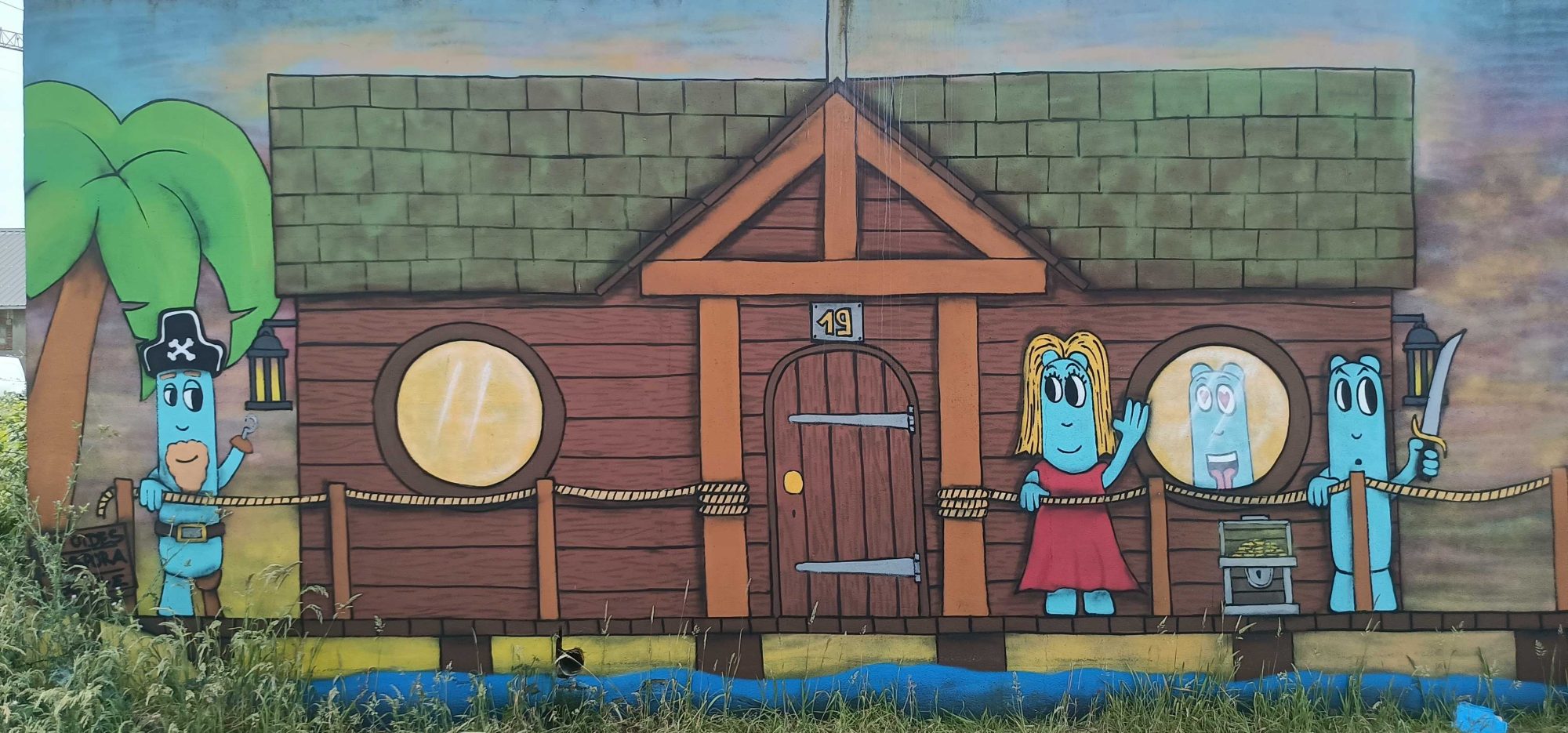 House with Blue Characters — Street art by Les Oides in Saint-Nazaire