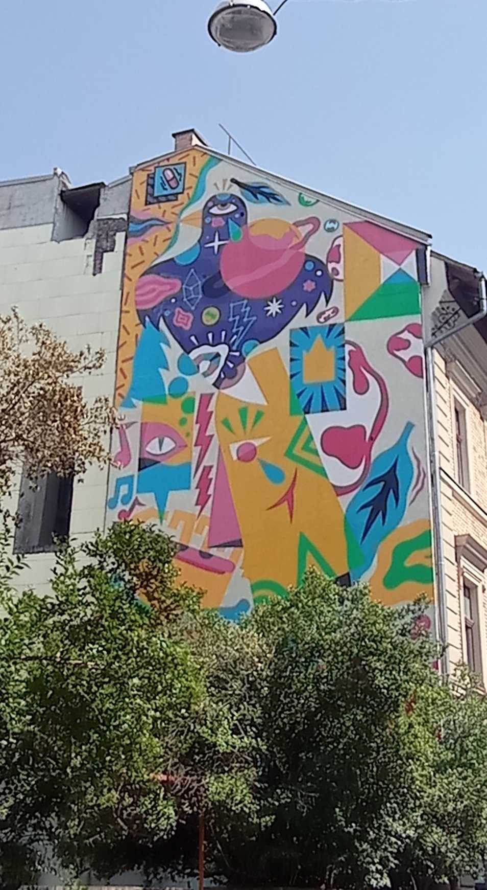 Graphic Bird with Colorful Shapes — Street art in Budapest