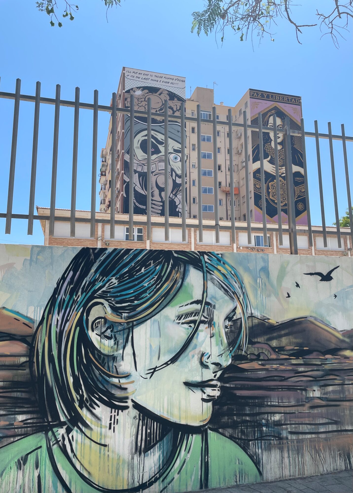 Enjoying the coast — Street art by Alice Pasquini in Málaga