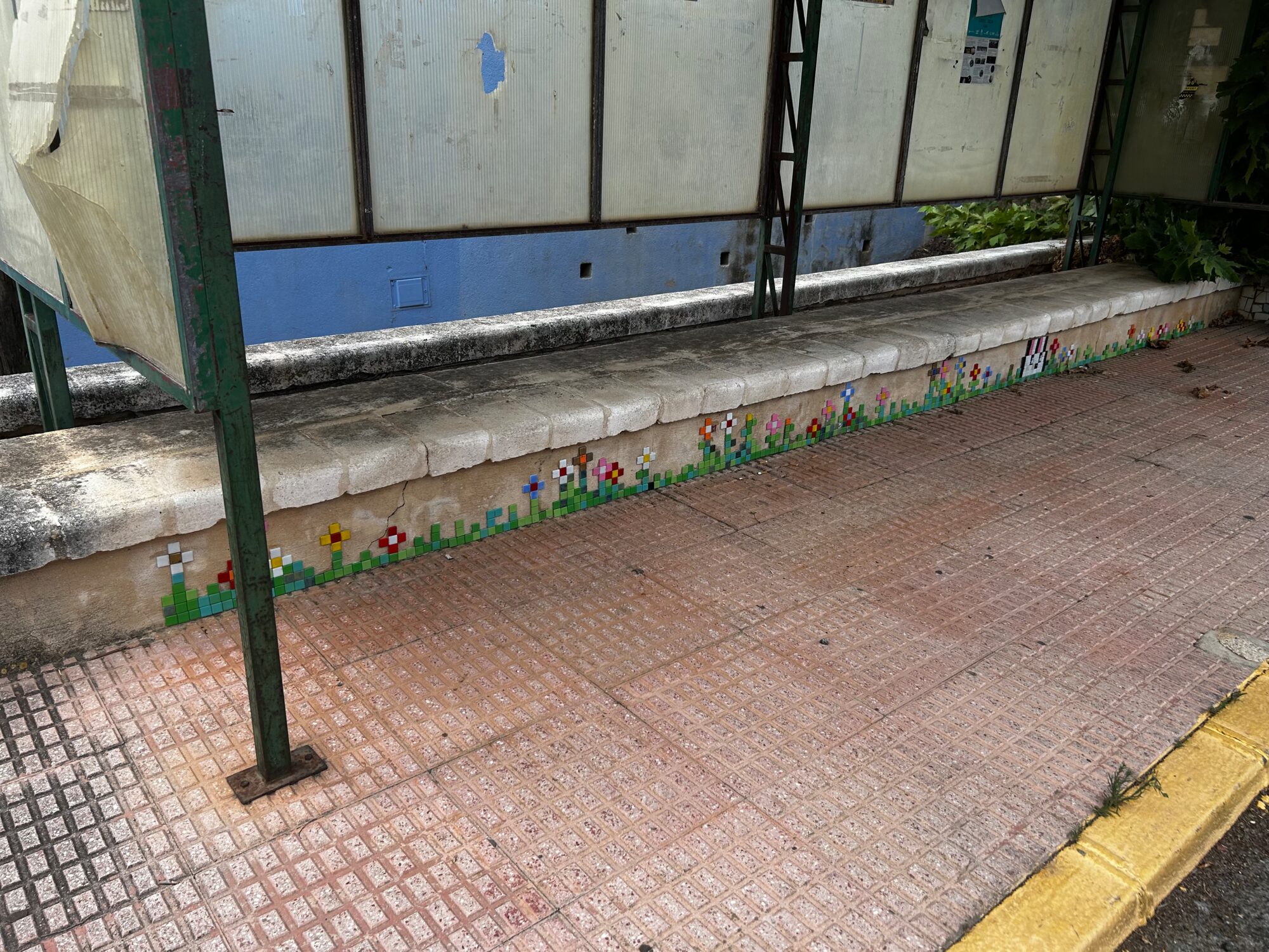 The Bunny and the Bus-Shelter Flowers — Street art by Astro Boy in Beniarbeig