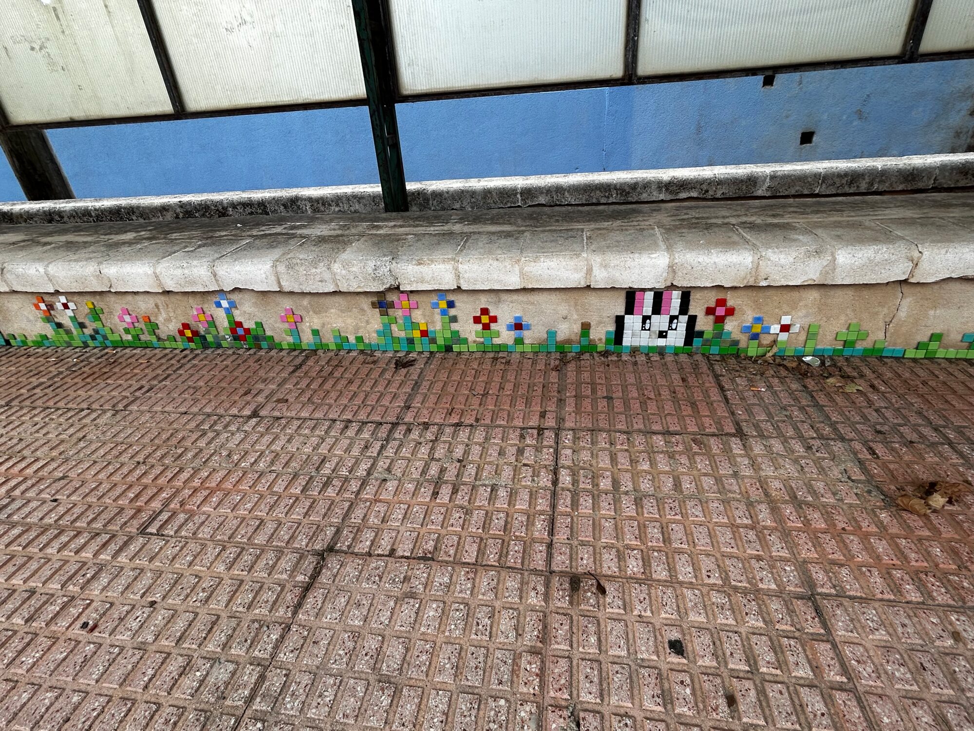 The Bunny and the Bus-Shelter Flowers — Street art by Astro Boy in Beniarbeig