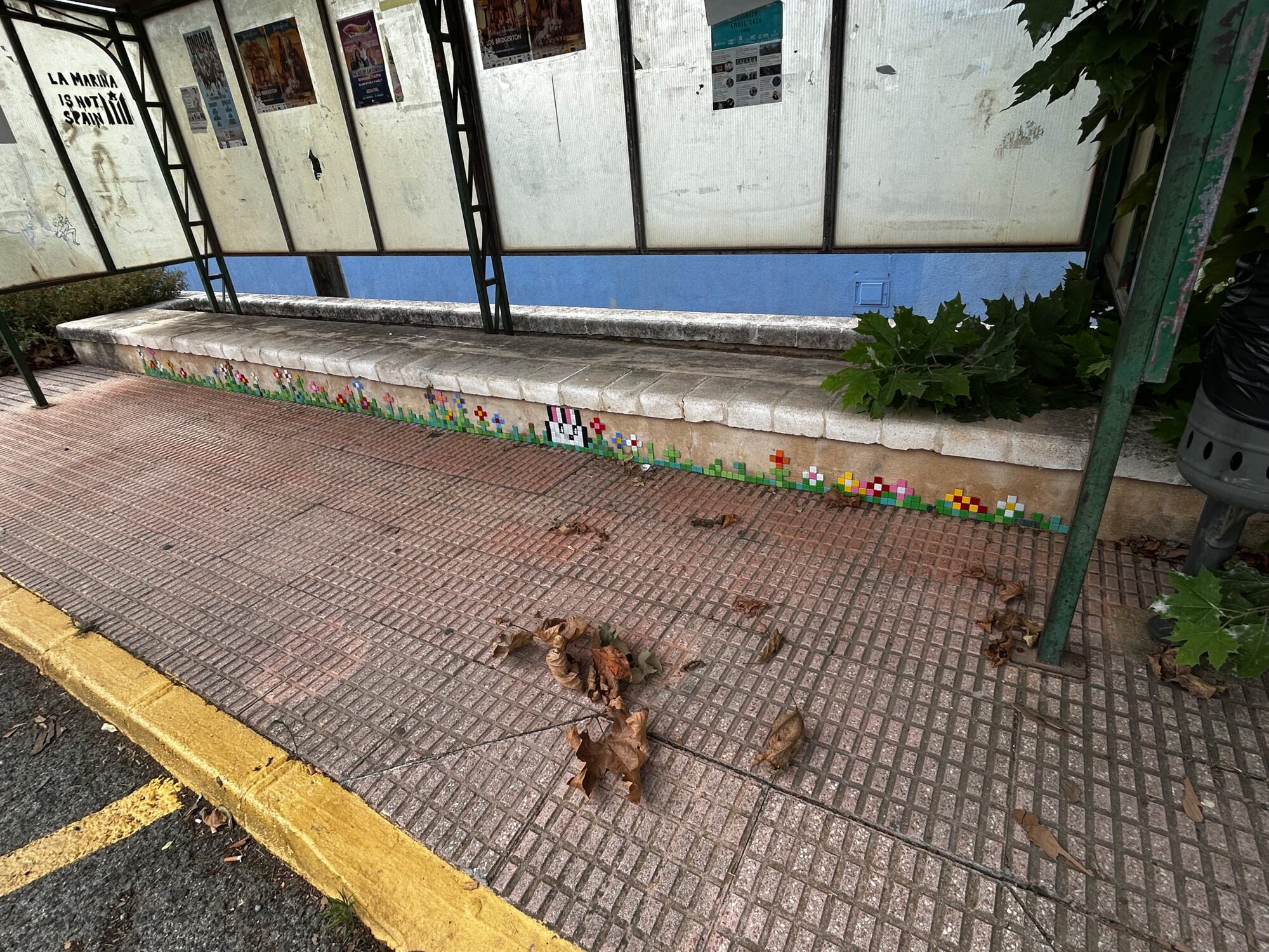 The Bunny and the Bus-Shelter Flowers — Street art by Astro Boy in Beniarbeig