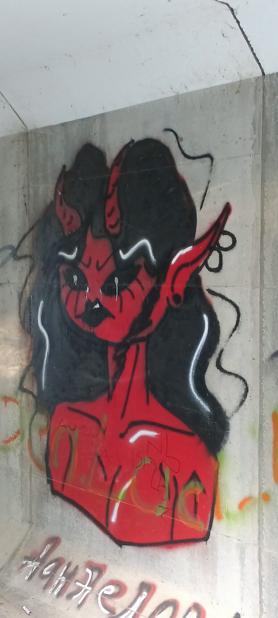 Red Demon Woman Under the Bridge — Street art in Sucé-sur-Erdre