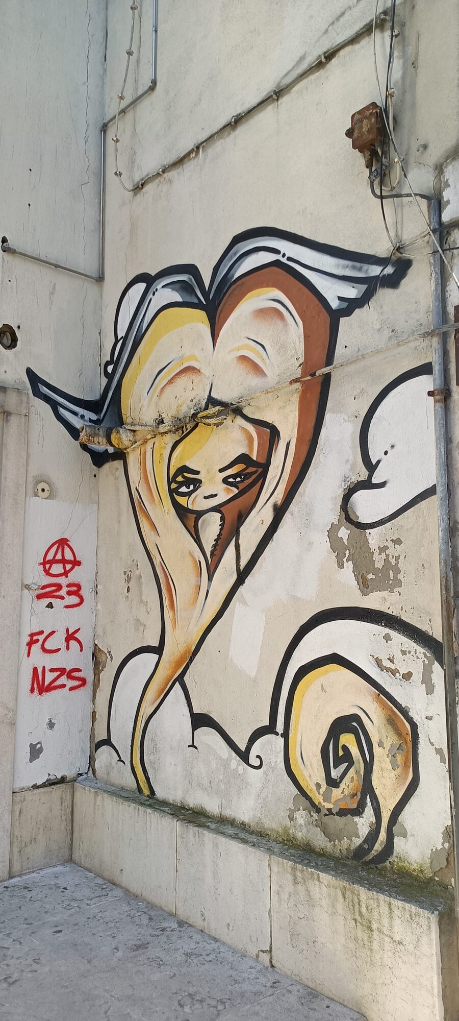 Upside-Down Cherub on Clouds — Street art in Lisboa