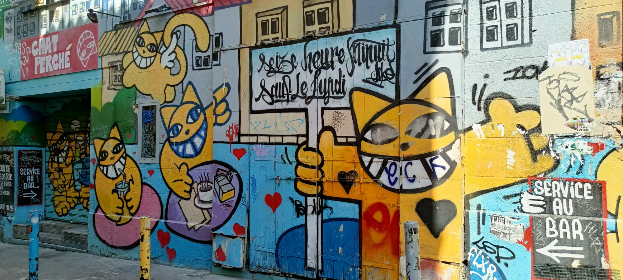 Yellow cat façade by M. Chat — Street art by M. Chat in Marseille