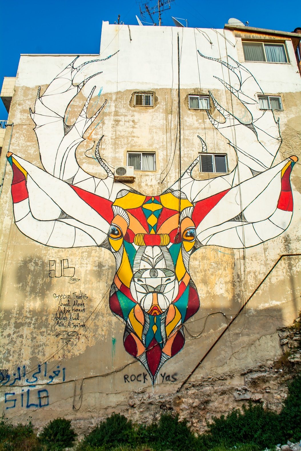 Geometric Deer — Street art by Suhaib Attar in Amman