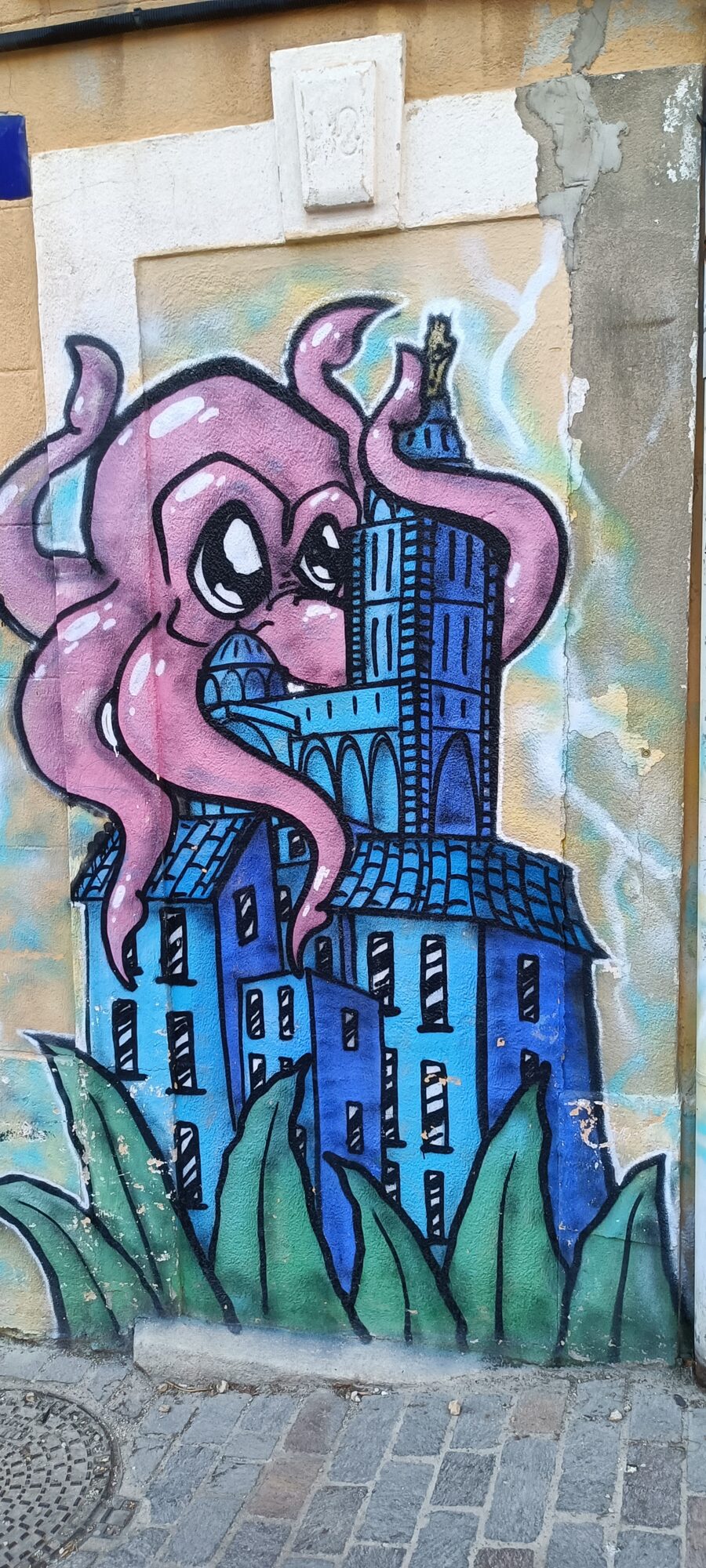 Pink octopus embracing Notre-Dame de la Garde — Street art in Marseille