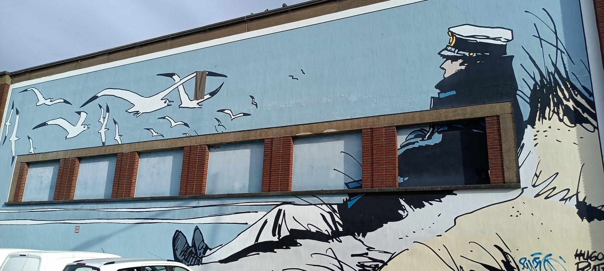 Corto Maltese facing the gulls — Street art by Hugo Pratt in Bruxelles