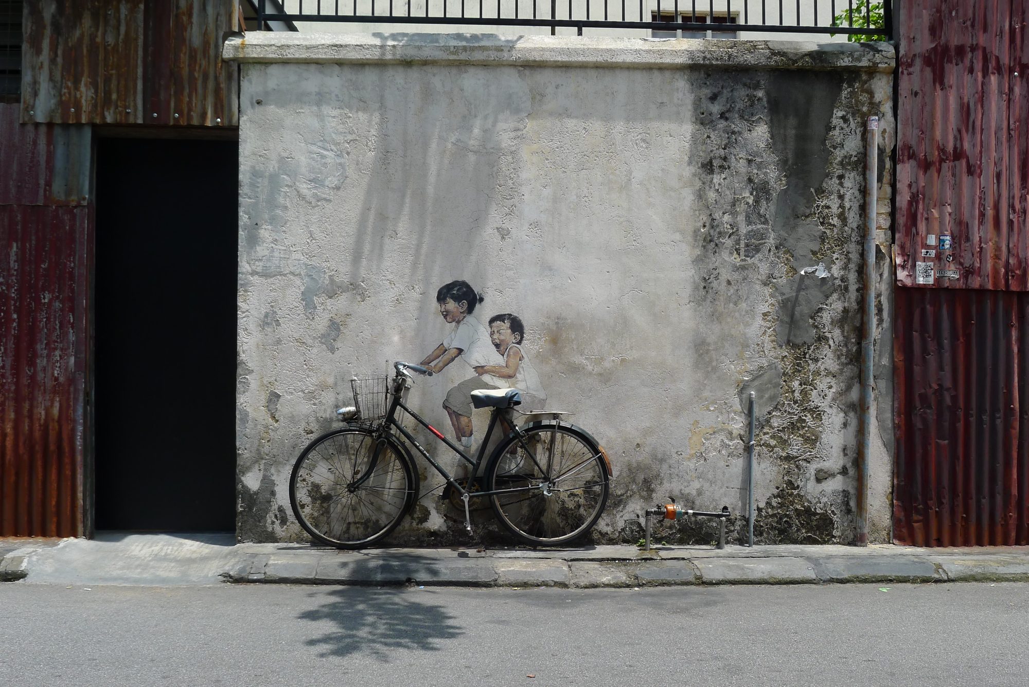 Children on a Bicycle — Street art by Ernest Zacharevic in George Town