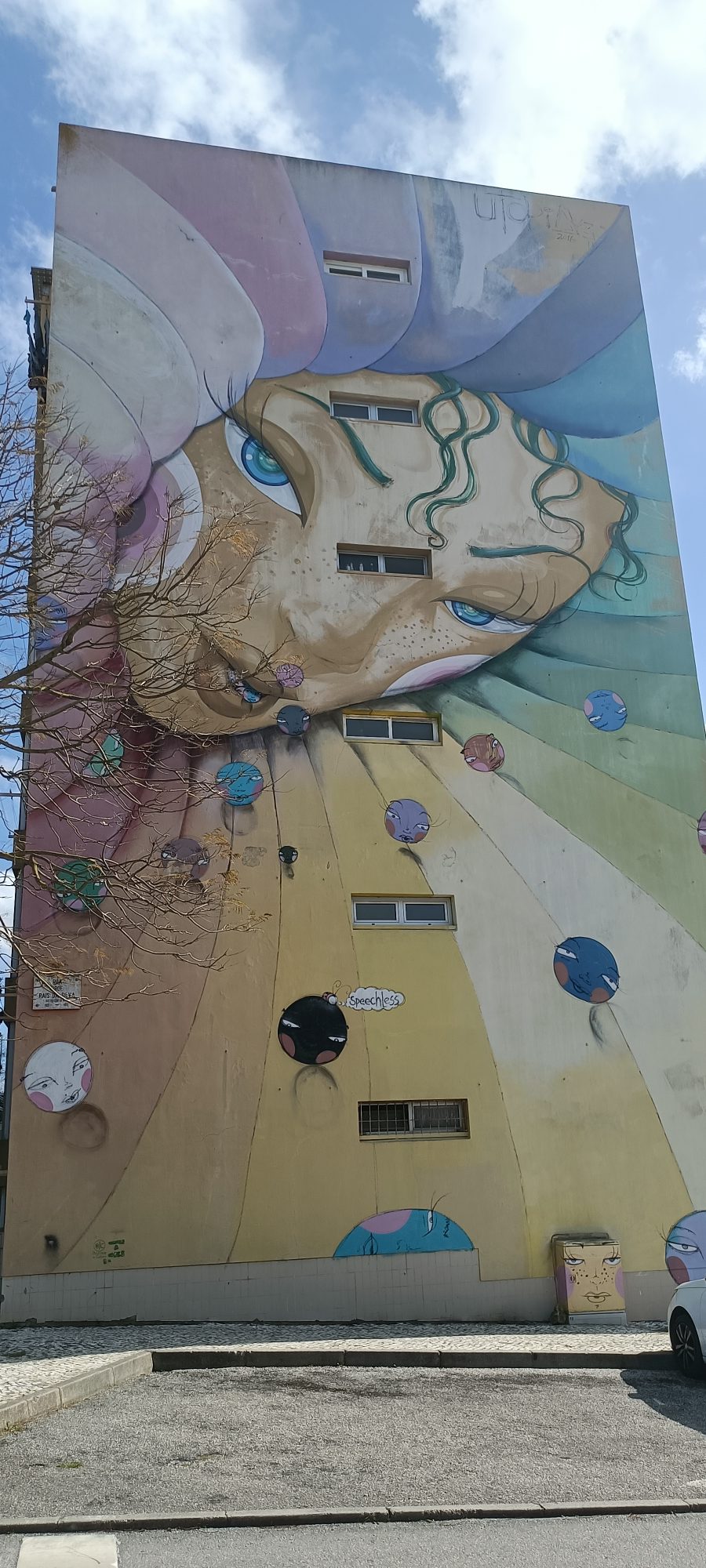 Face with Rainbow Hair — Street art by Utopia in Lisbon