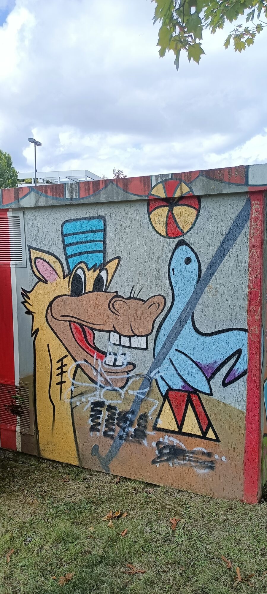 Wolf bandleader and blue bird — Street art in Yffiniac
