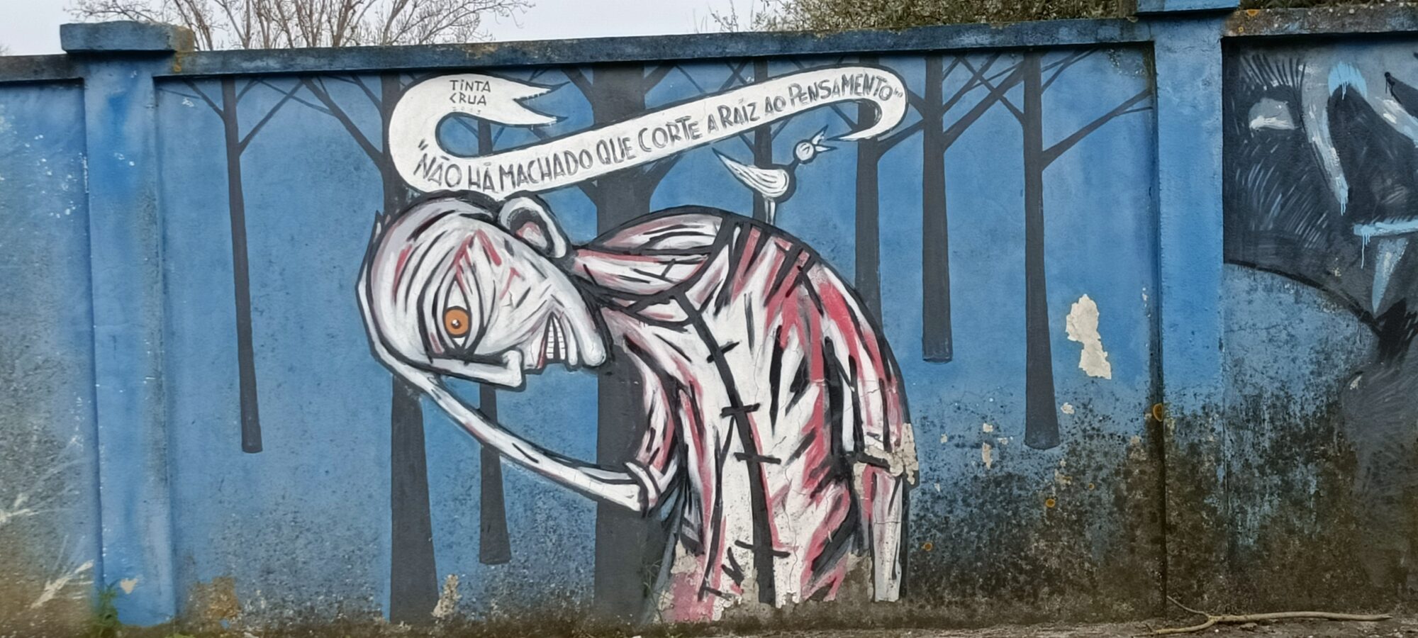 No axe cuts the root of thought — Street art by Tinta Crua in Lisboa