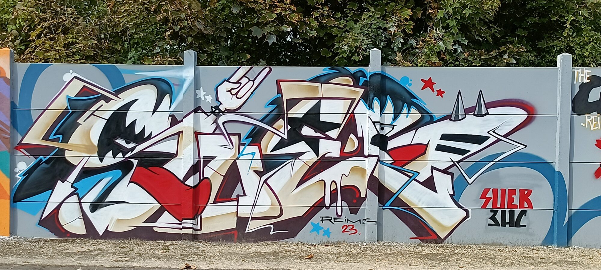 Cream and Red Lettering with Rabbit Ears — Street art in Reims