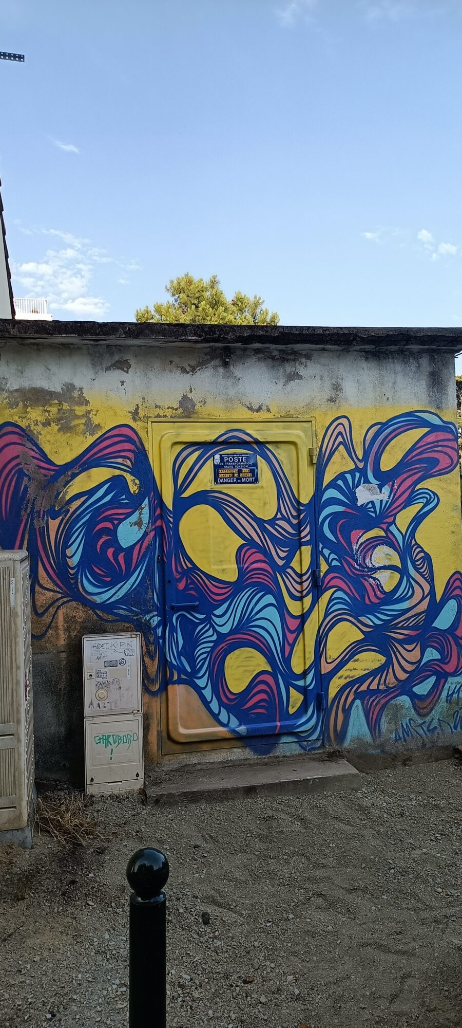 Blue Arabesques on an Electrical Substation — Street art in Pornic