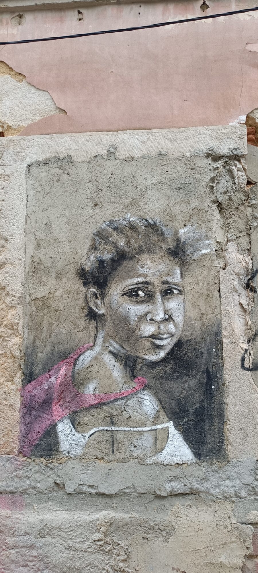 Young Woman in a Pink Vest — Street art by Rosarlette Meirelles in Almada