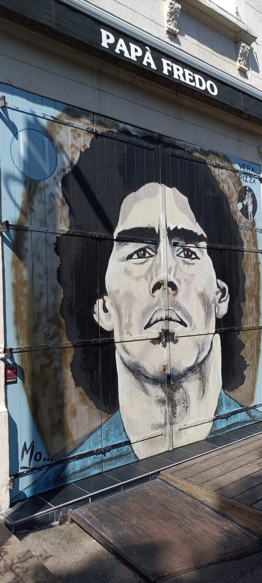Maradona on the pizzeria shutter — Street art in Marseille