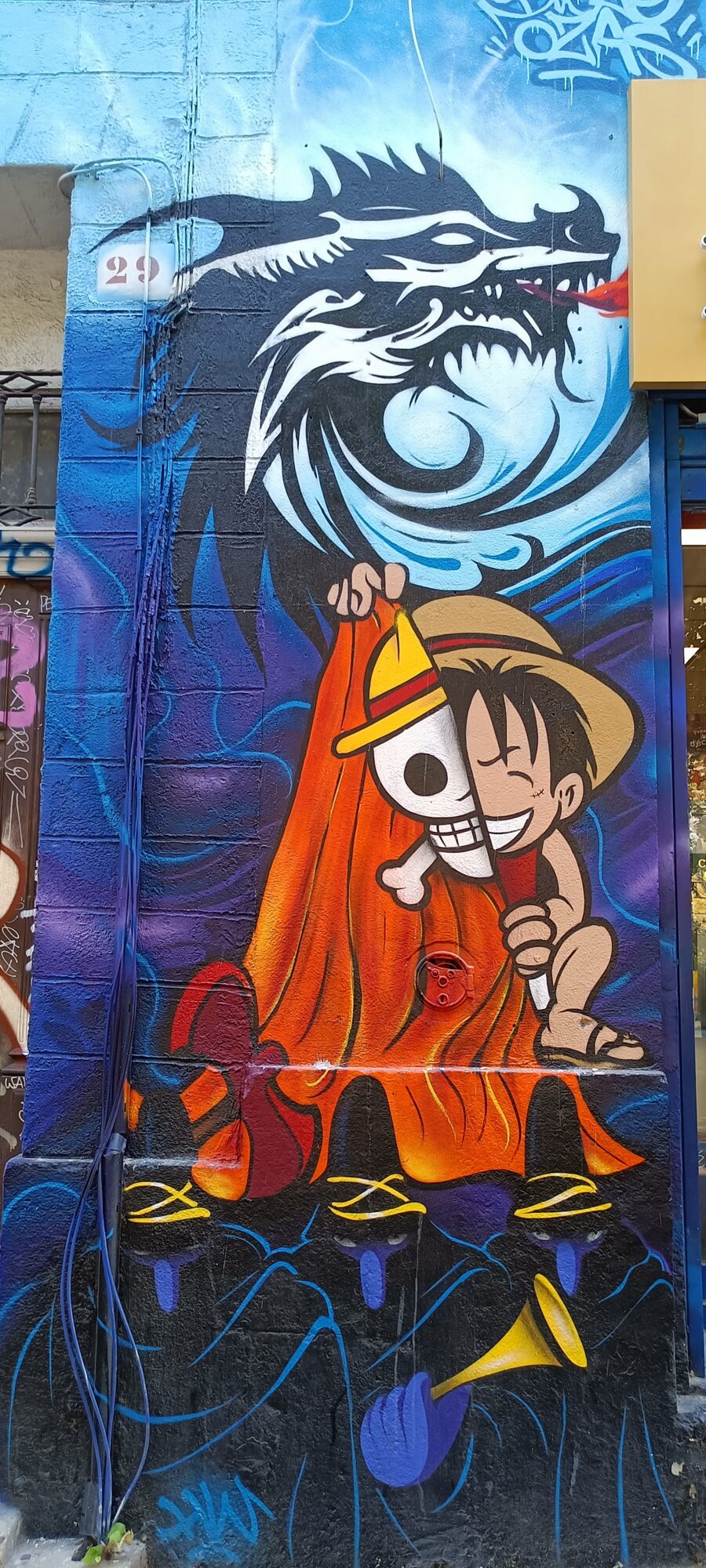 Luffy and the white dragon — Street art in Marseille