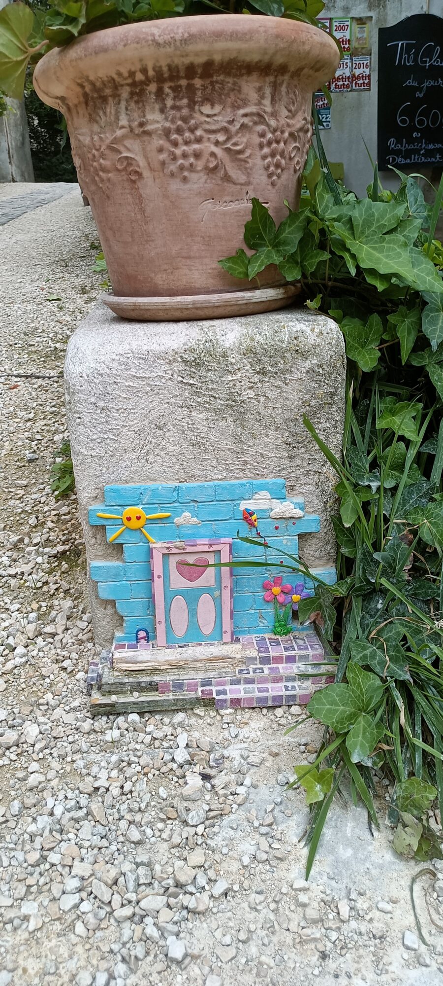 Miniature Door with Sun and Flowers — Street art by Florizale in Bourges