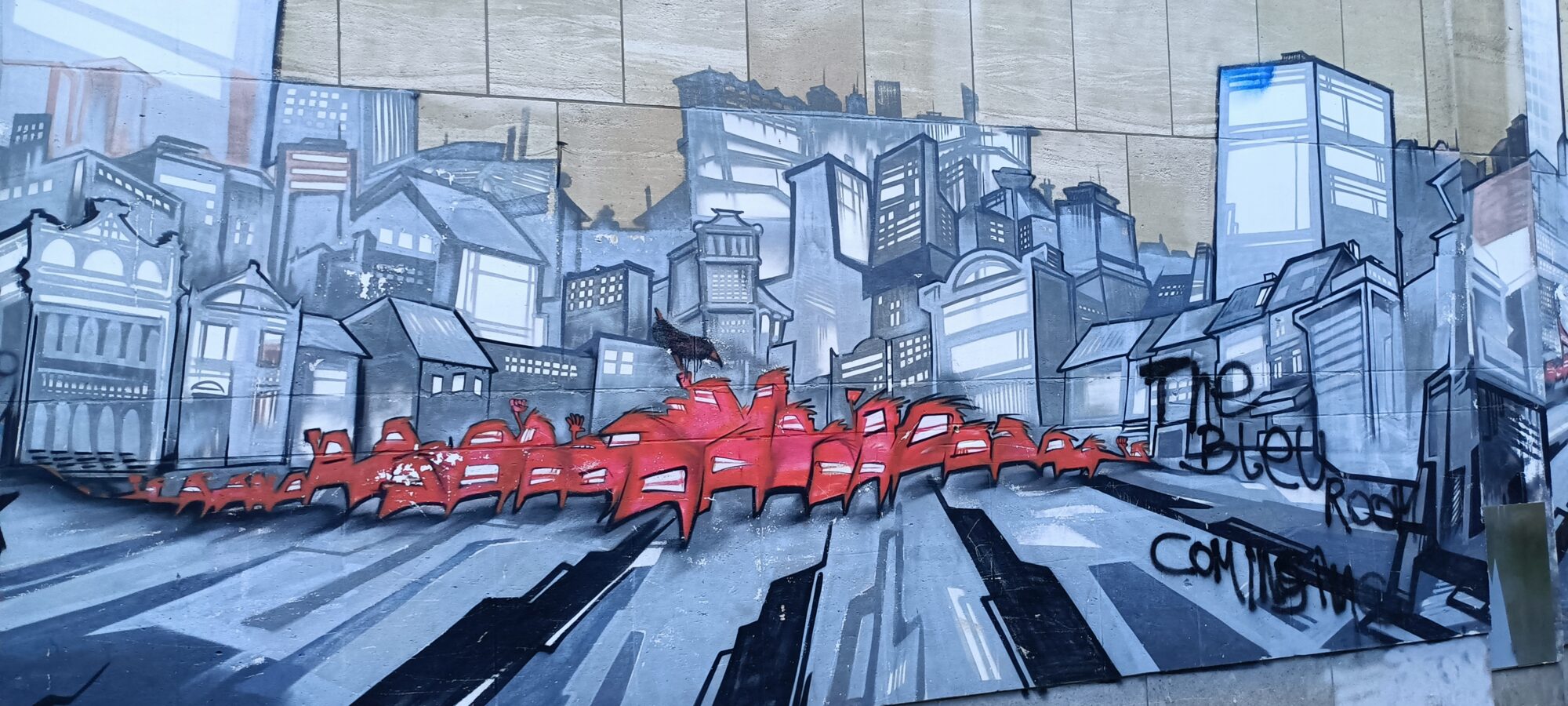 The Red Crowd Crossing the Grey City — Street art in Bruxelles