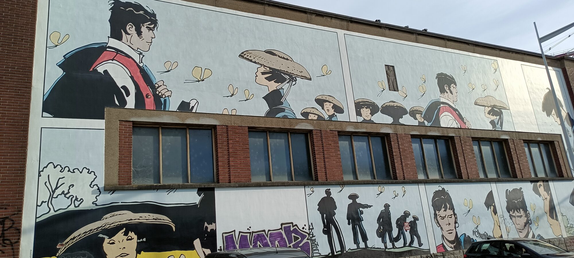 Corto Maltese and the straw hats — Street art by Hugo Pratt in Bruxelles