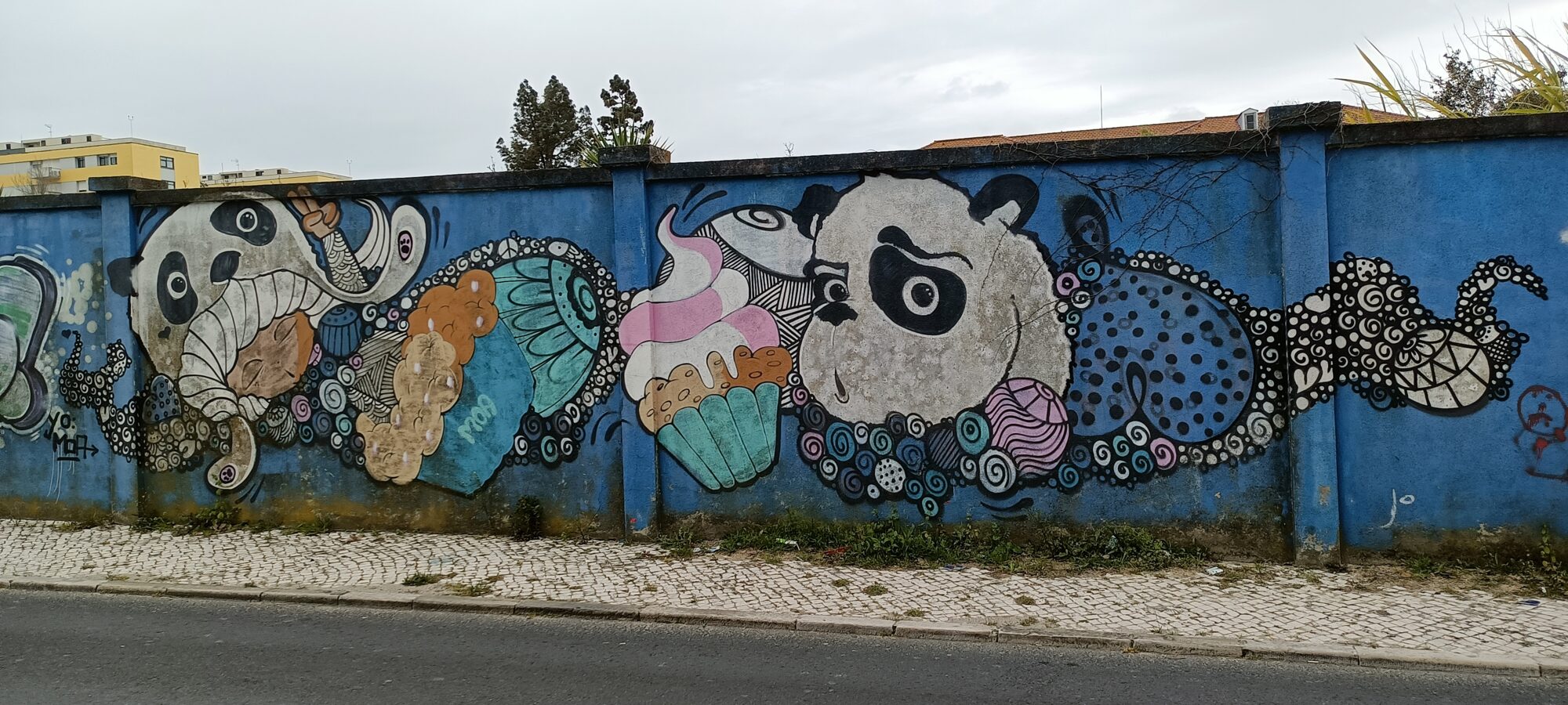 Pandas and cupcakes in doodles — Street art in Lisboa
