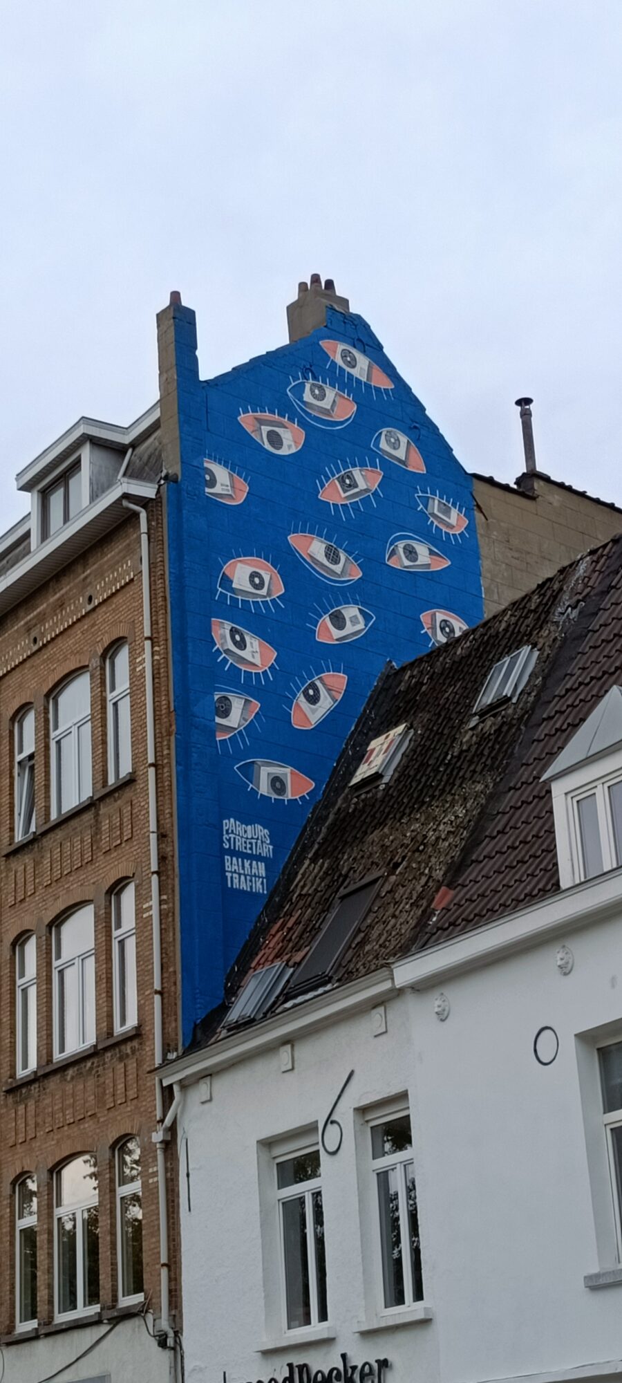 Wink, the Air-Conditioner Eyes by Ledia Kostandini — Street art by Ledia Kostandini in Bruxelles