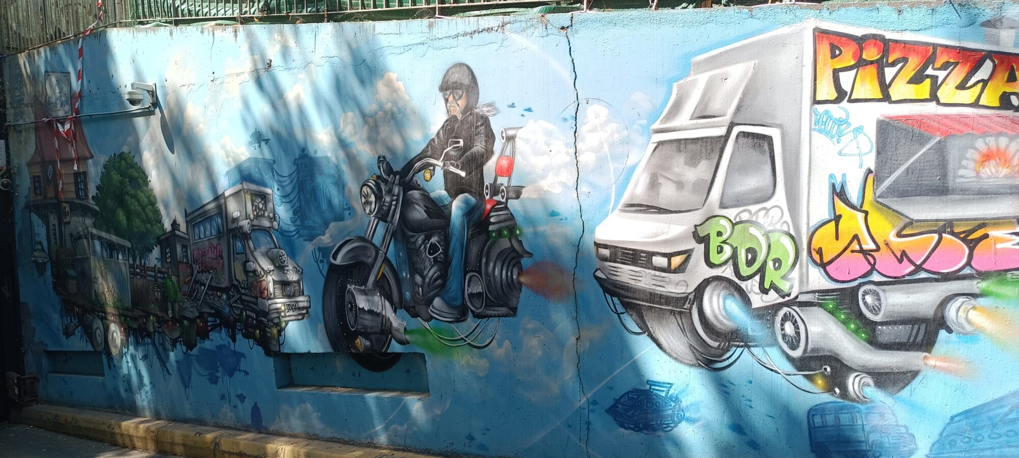 Collective wall with the flying pizza van — Street art in Marseille