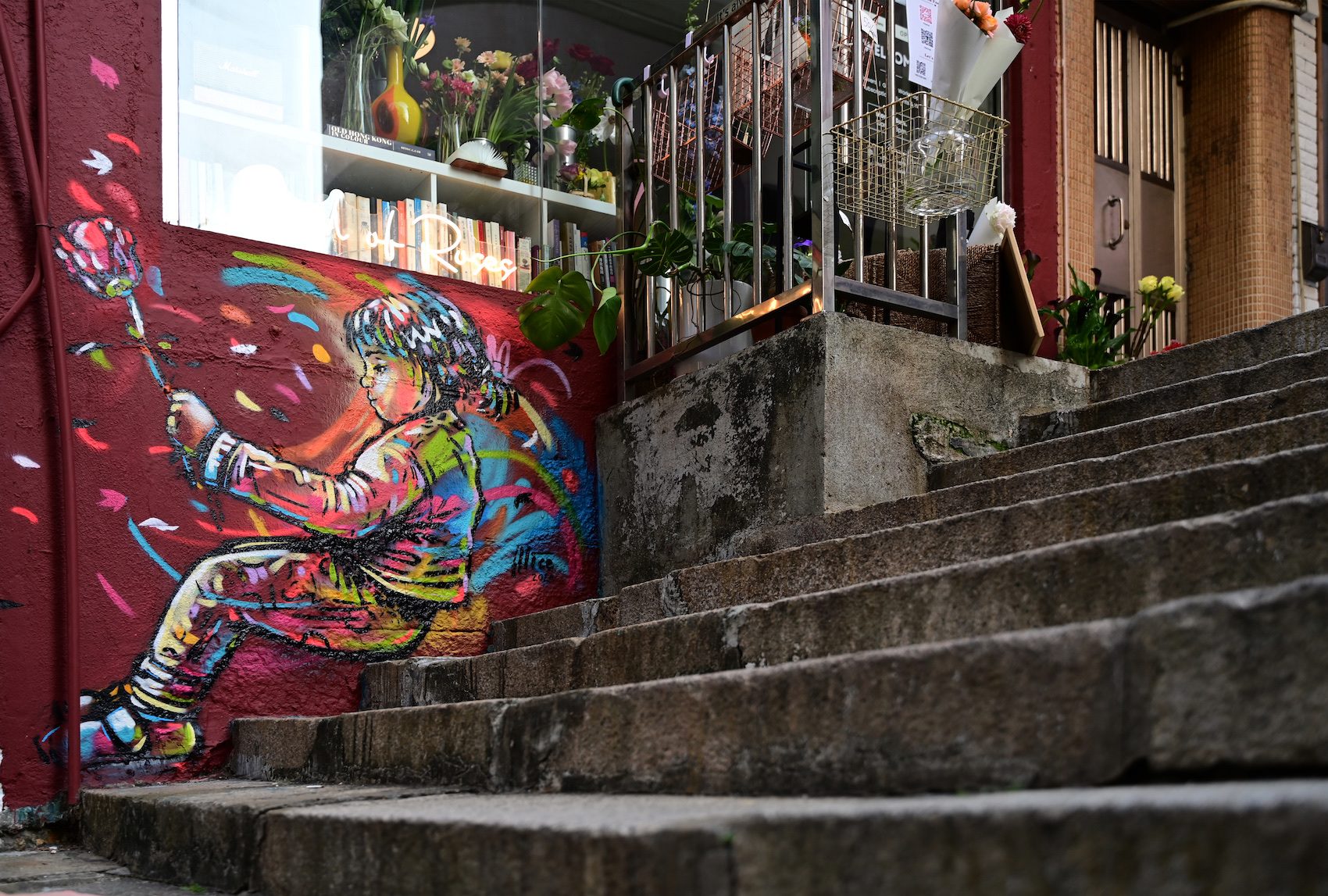 Child with Crane — Street art by Alice Pasquini in Hong Kong