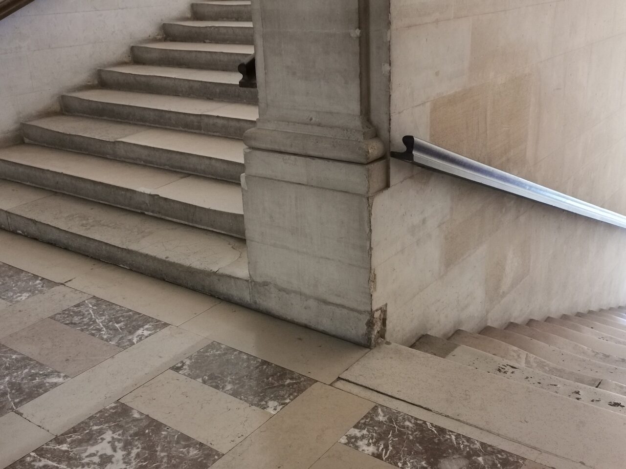 PA_141, Space Invader on a Louvre Staircase — Street art by Invader in Paris