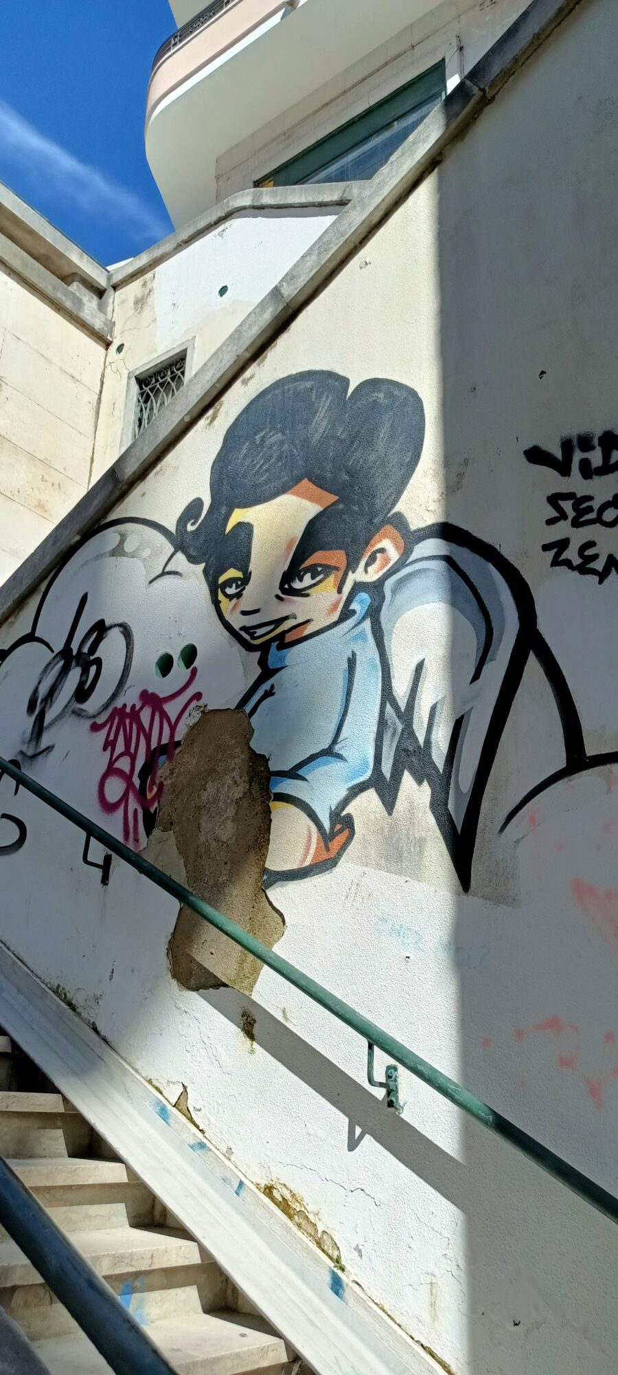Pompadour Cherub on a Lisbon Stairway — Street art in Lisboa