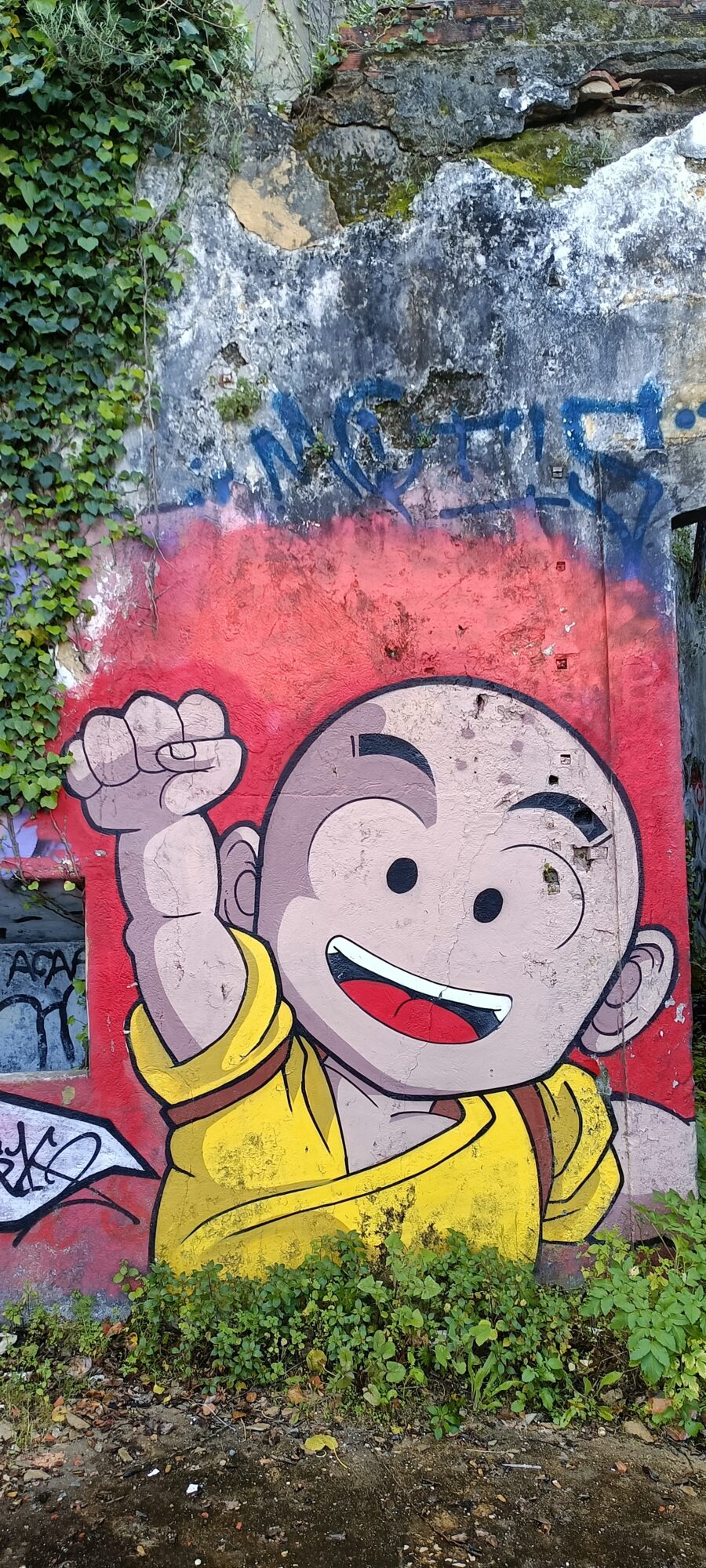 Krillin from Dragon Ball Z with a Raised Fist — Street art in Lisboa