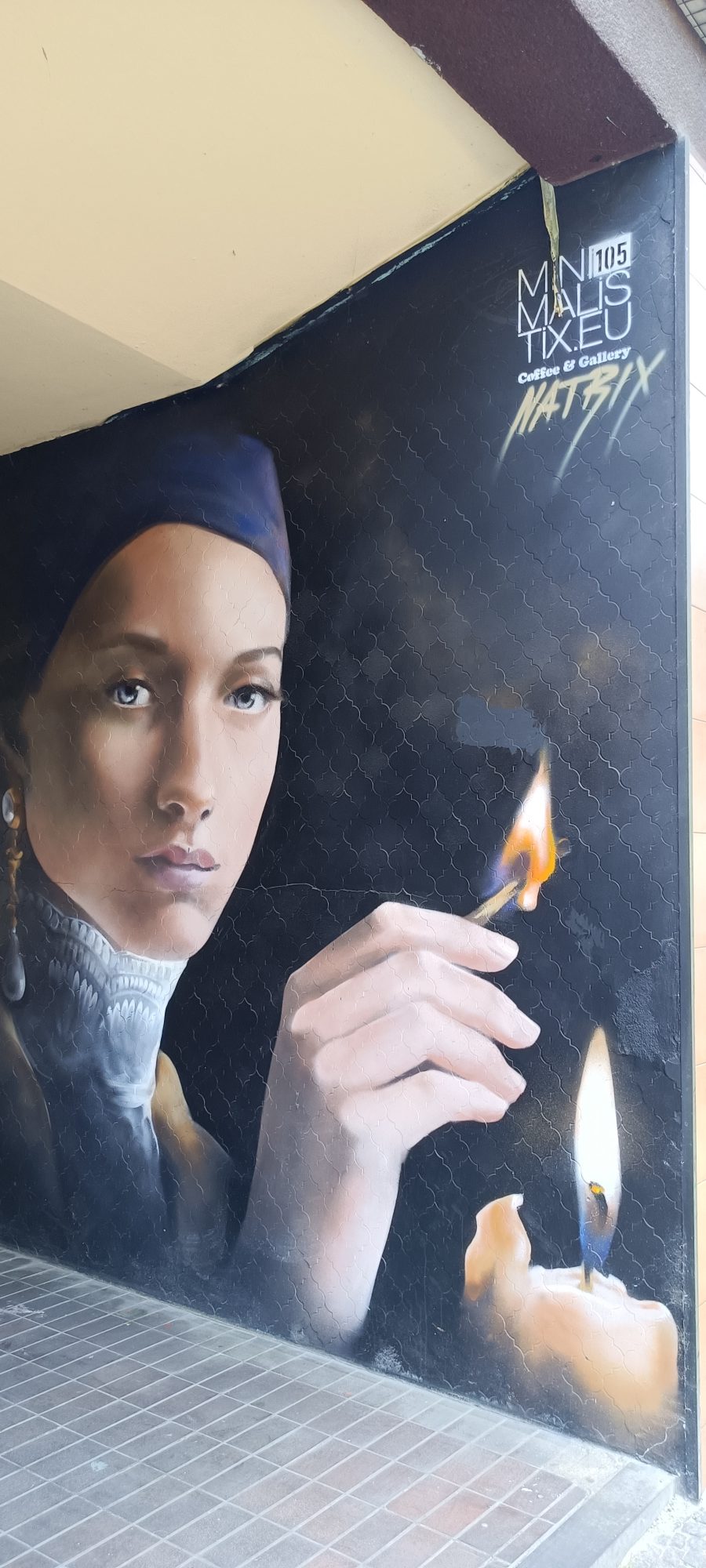 The Woman with the Match — Street art in Berlin