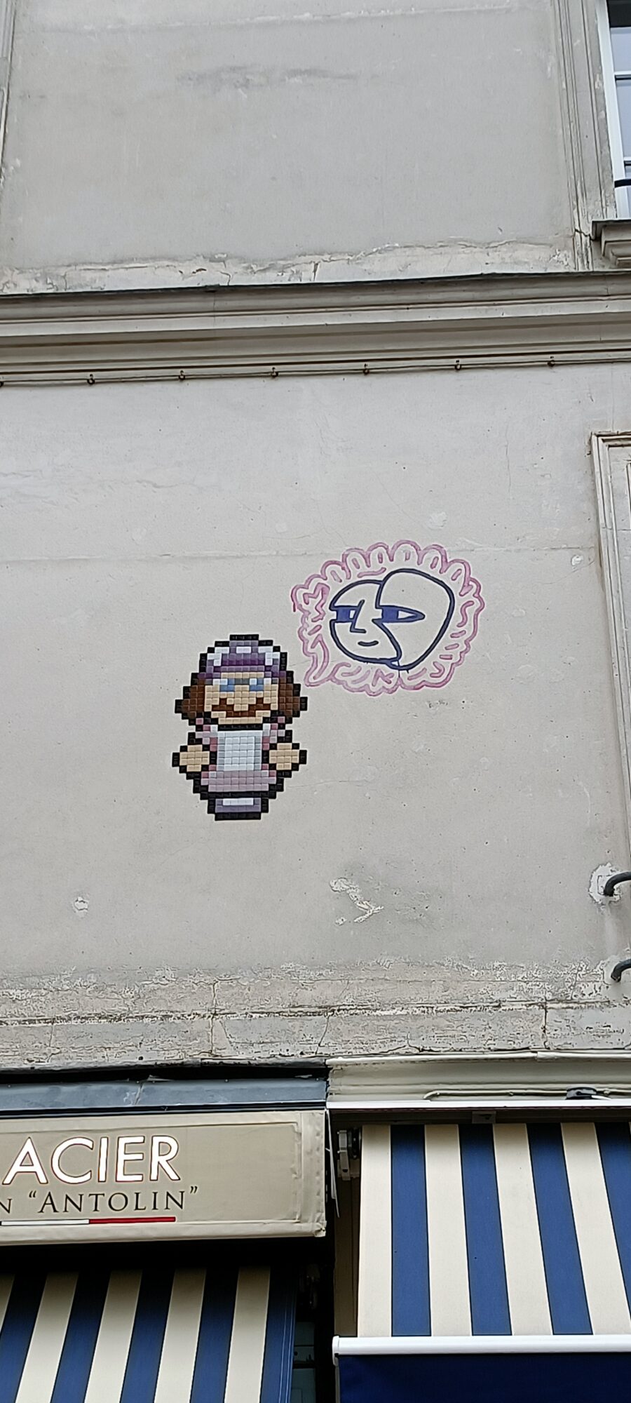 Mosaic character with a mauve cap — Street art by IN THE WOUP in Paris