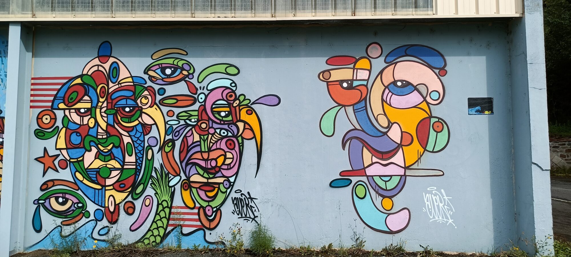Nested faces with many eyes — Street art in Saint-Brieuc
