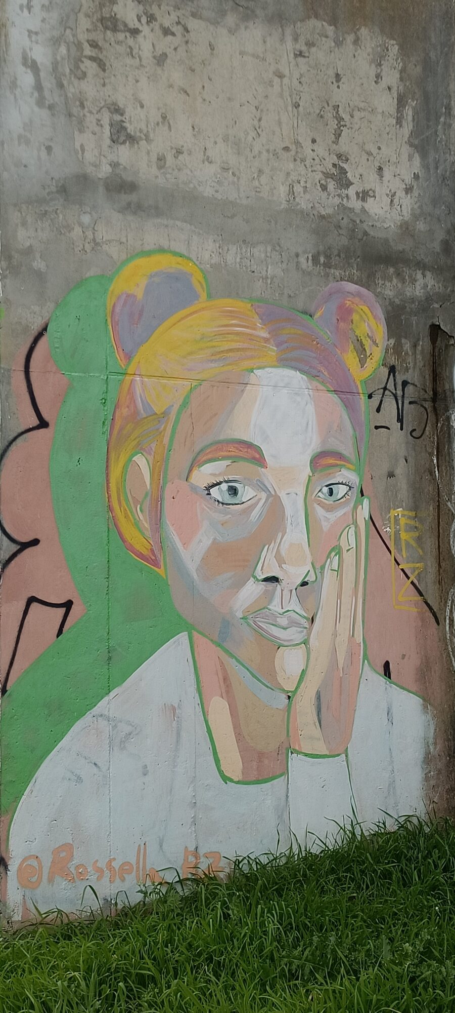 Young Woman with a Bun, Hand on Cheek — Street art in Lisboa