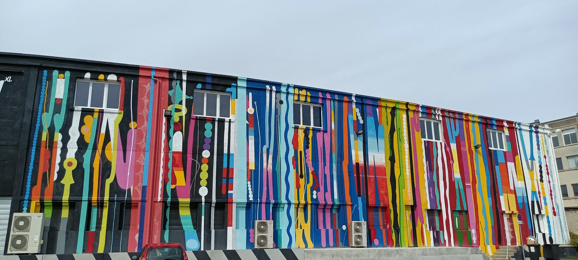 Facade with Multicoloured Vertical Drips — Street art by Grems in Reims