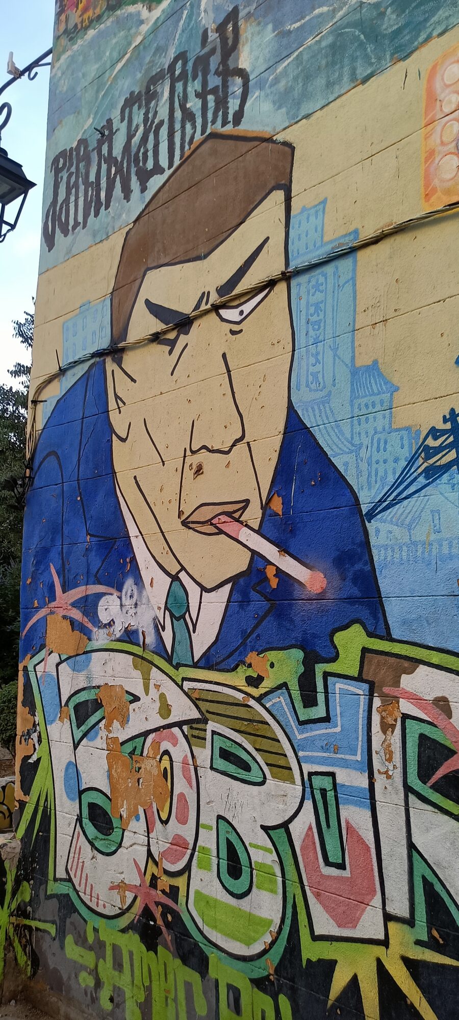 Man in a suit with a cigarette — Street art in Marseille