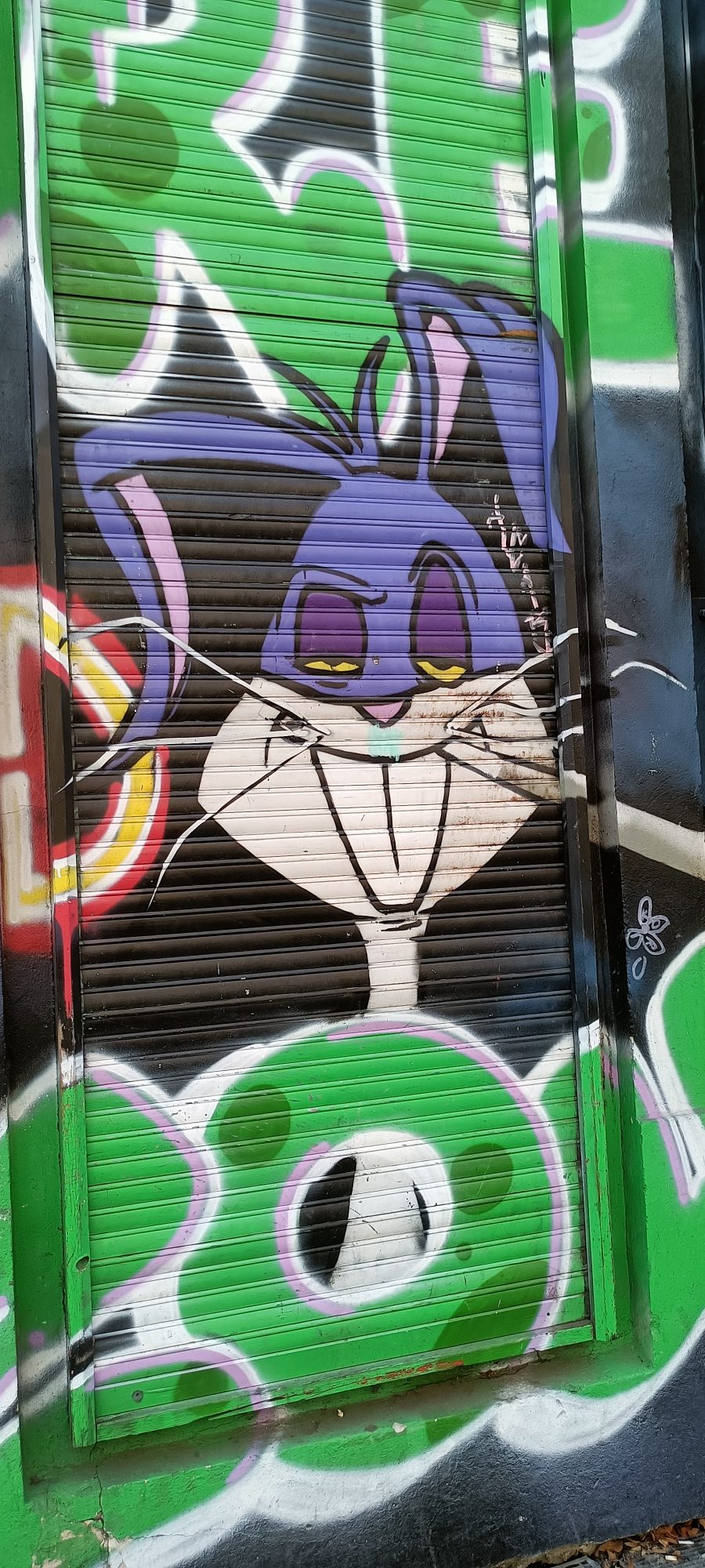 Purple Bugs Bunny on the Shutter — Street art in Berlin