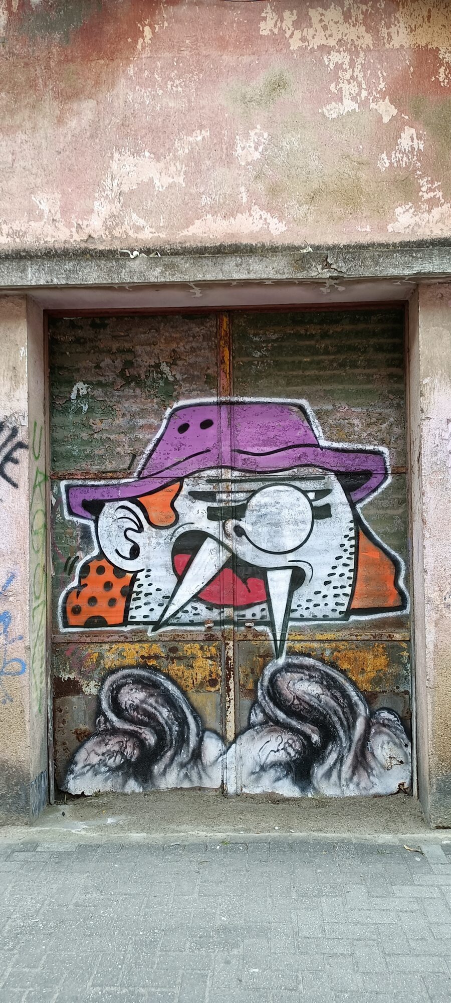 Bird in a Purple Hat on a Metal Door — Street art in Almada