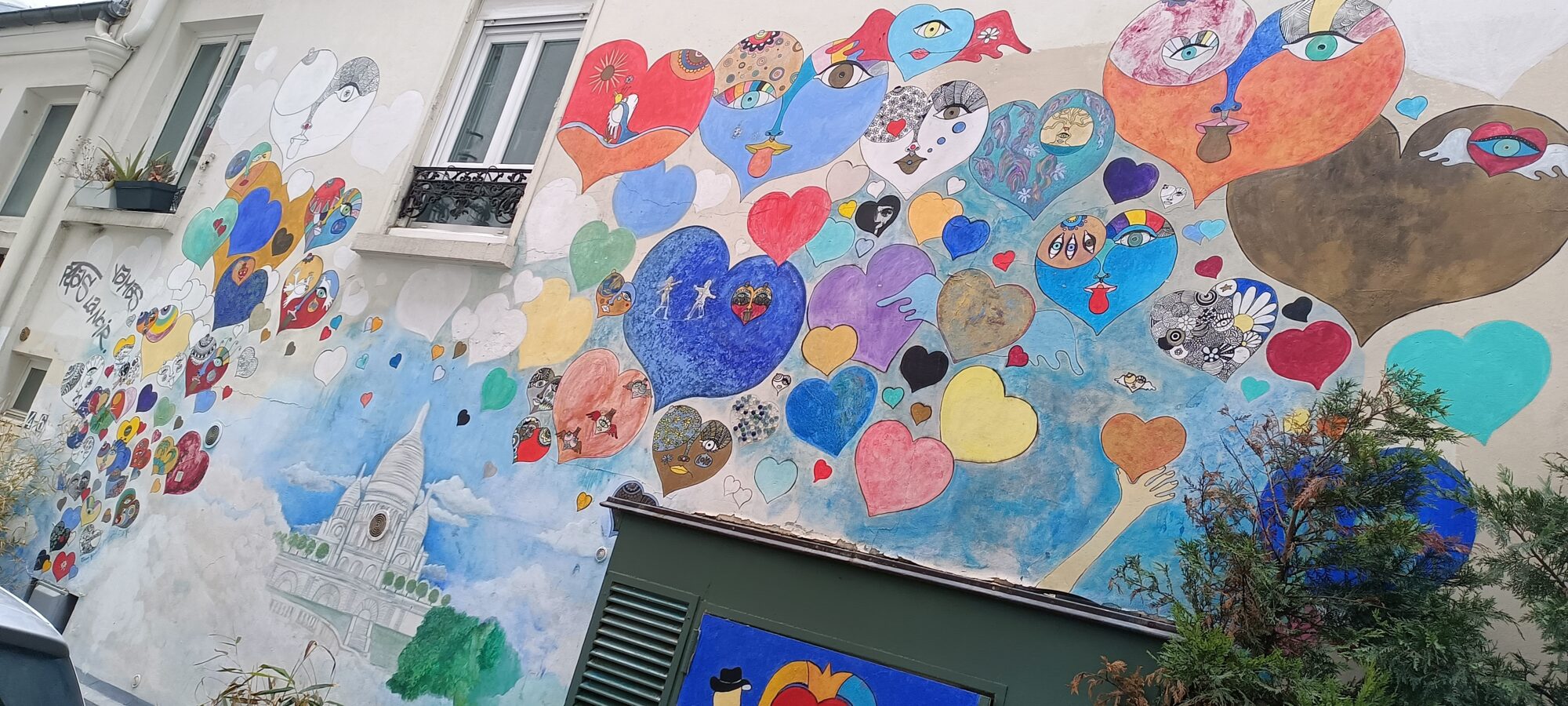 Flight of hearts above the Sacré-Coeur — Street art in Paris