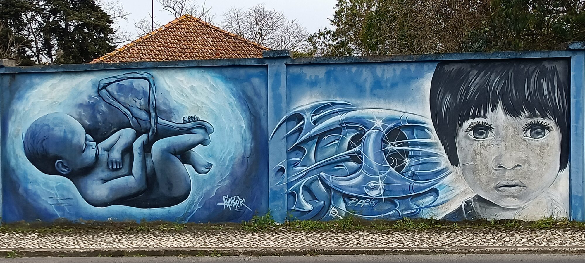 Blue foetus, machinery and a child's portrait — Street art in Lisboa