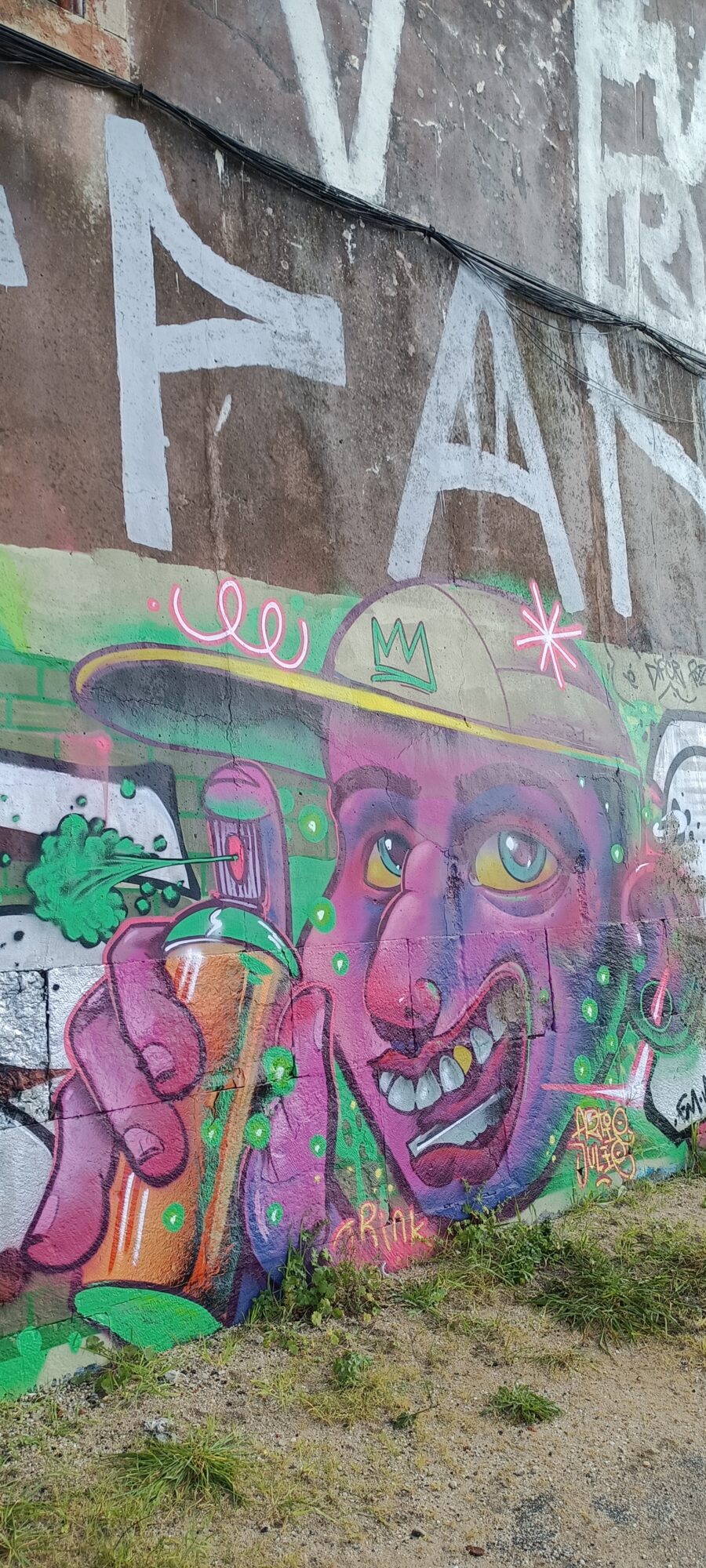 Purple Face with a Cap and Green Spray Can — Street art in Lisboa