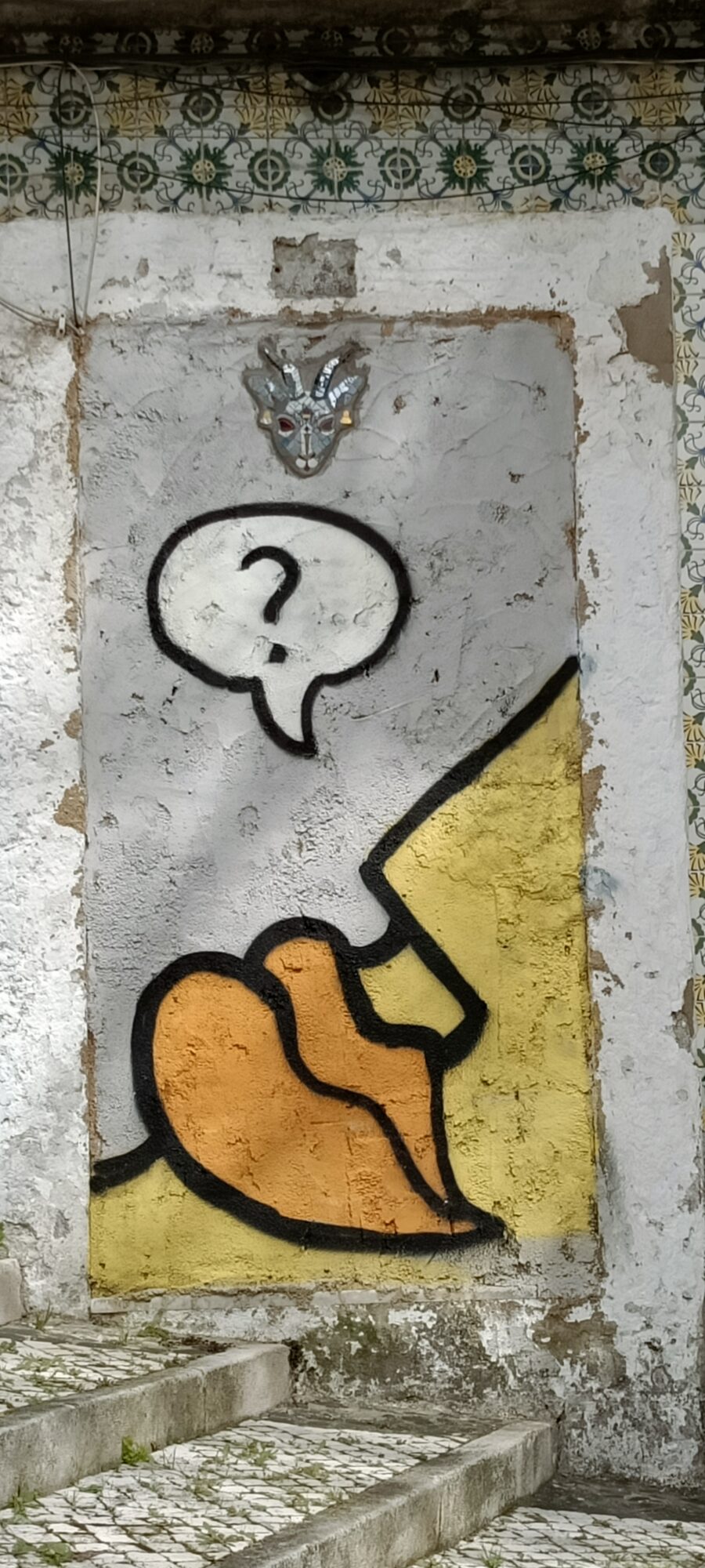 Orange Figure with a Question Mark — Street art in Lisboa