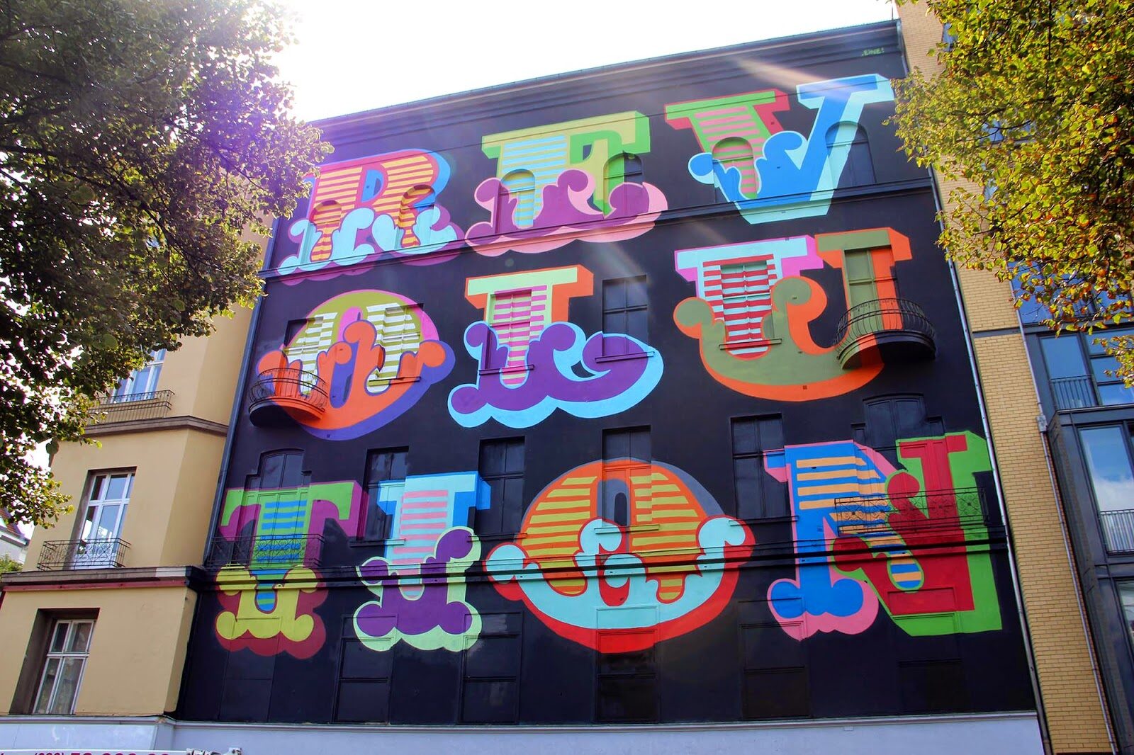 Revolution — Street art by Ben Eine in Berlin