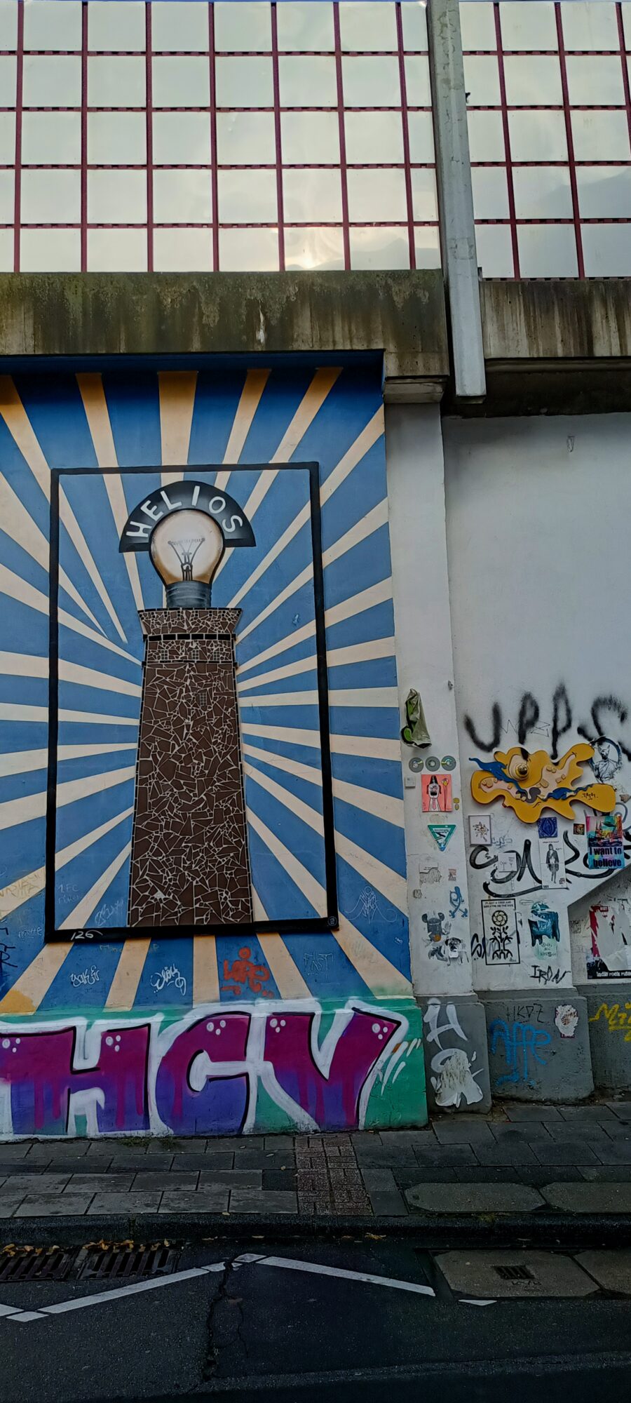 The Helios tower and its light bulb — Street art in Köln