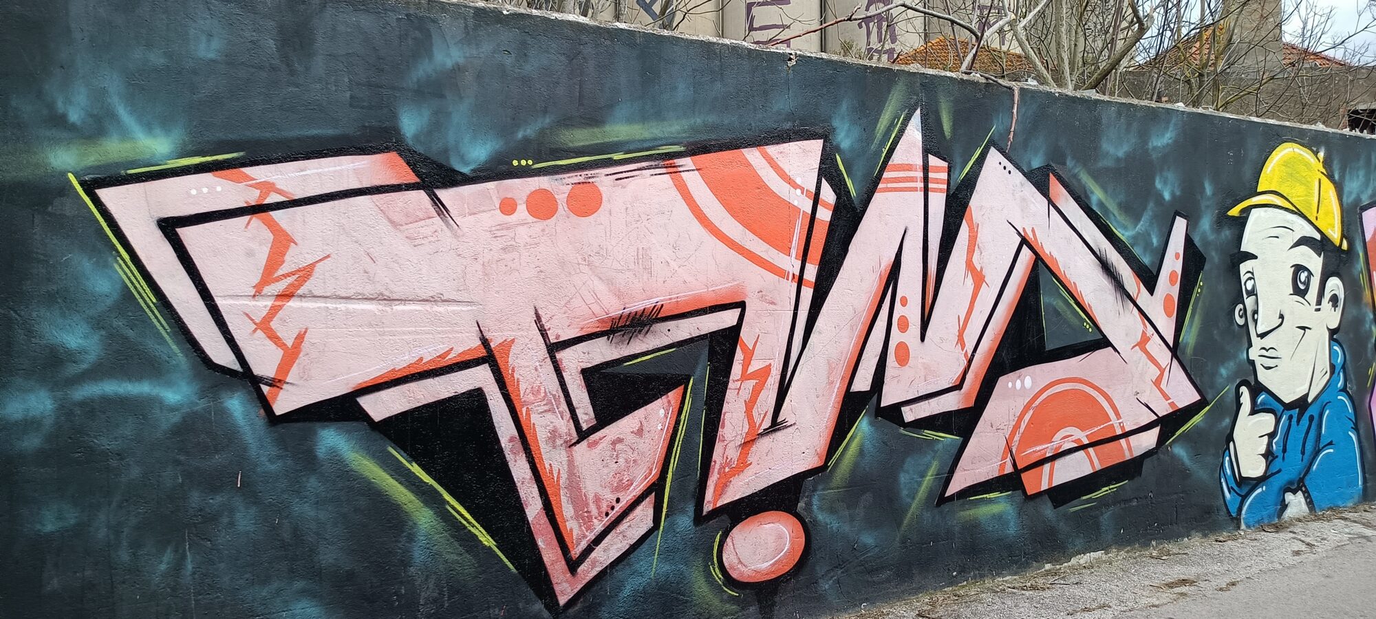Salmon Pink Lettering and Worker in a Yellow Helmet — Street art in Almada