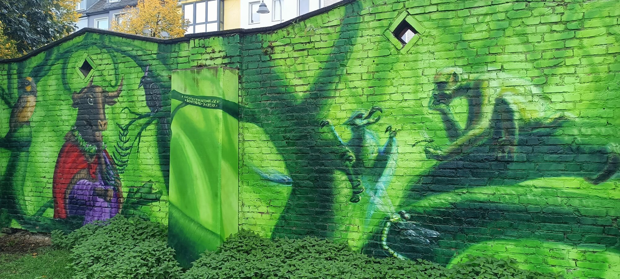 The bull in a red cloak and its jungle — Street art by Colorrevolution e.V. in Köln